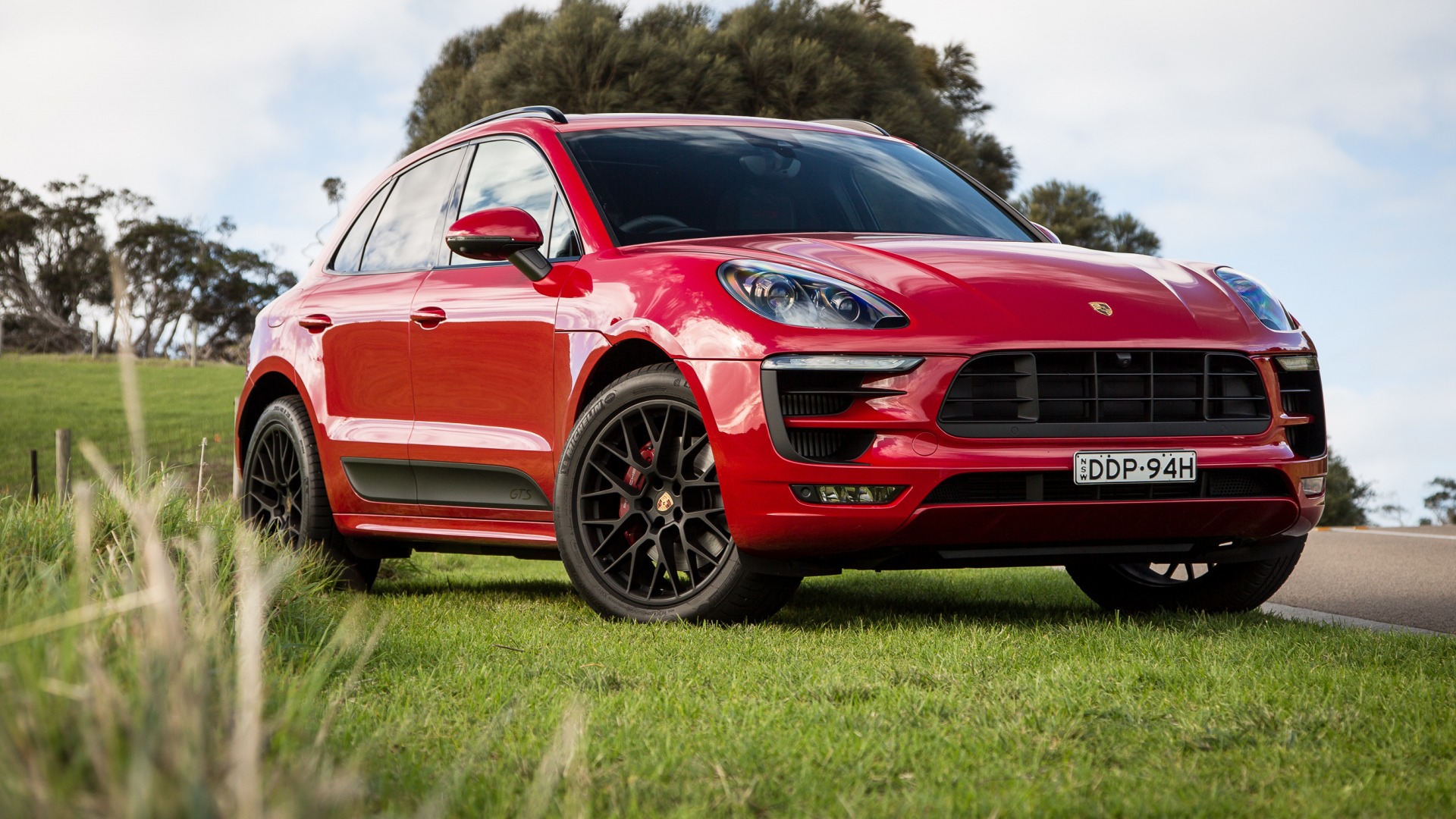 General 1920x1080 red cars numbers grass vehicle Porsche Porsche Cayenne SUV German cars Volkswagen Group car frontal view licence plates headlights trees sky overcast clouds