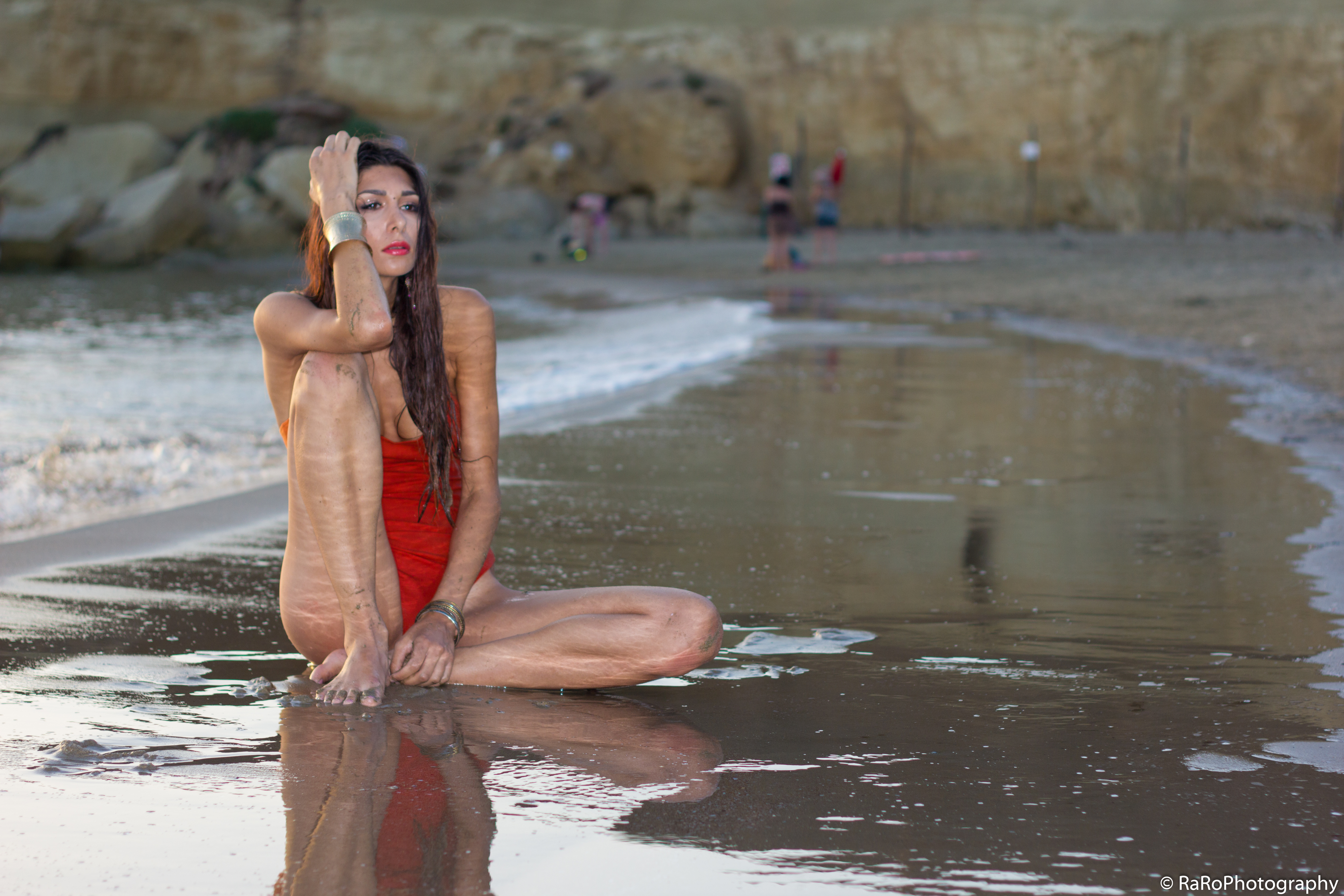 People 5058x3372 Veronica Biancaniello women model sitting beach water one-piece swimsuit bracelets outdoors watermarked