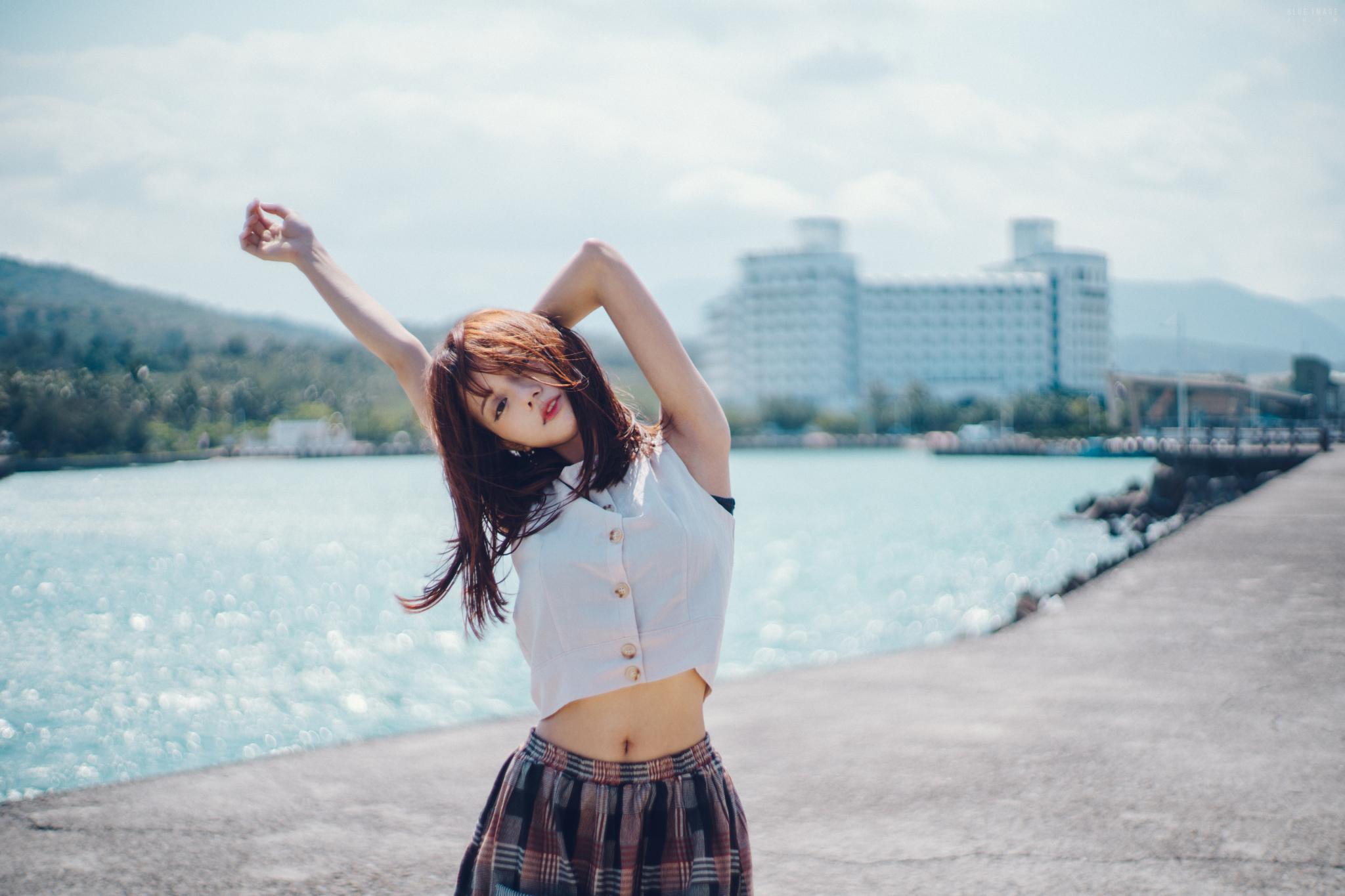 People 2048x1365 Asian women model brunette portrait hair in face arms up white tops belly skirt river depth of field sky frontal view outdoors women outdoors looking at viewer