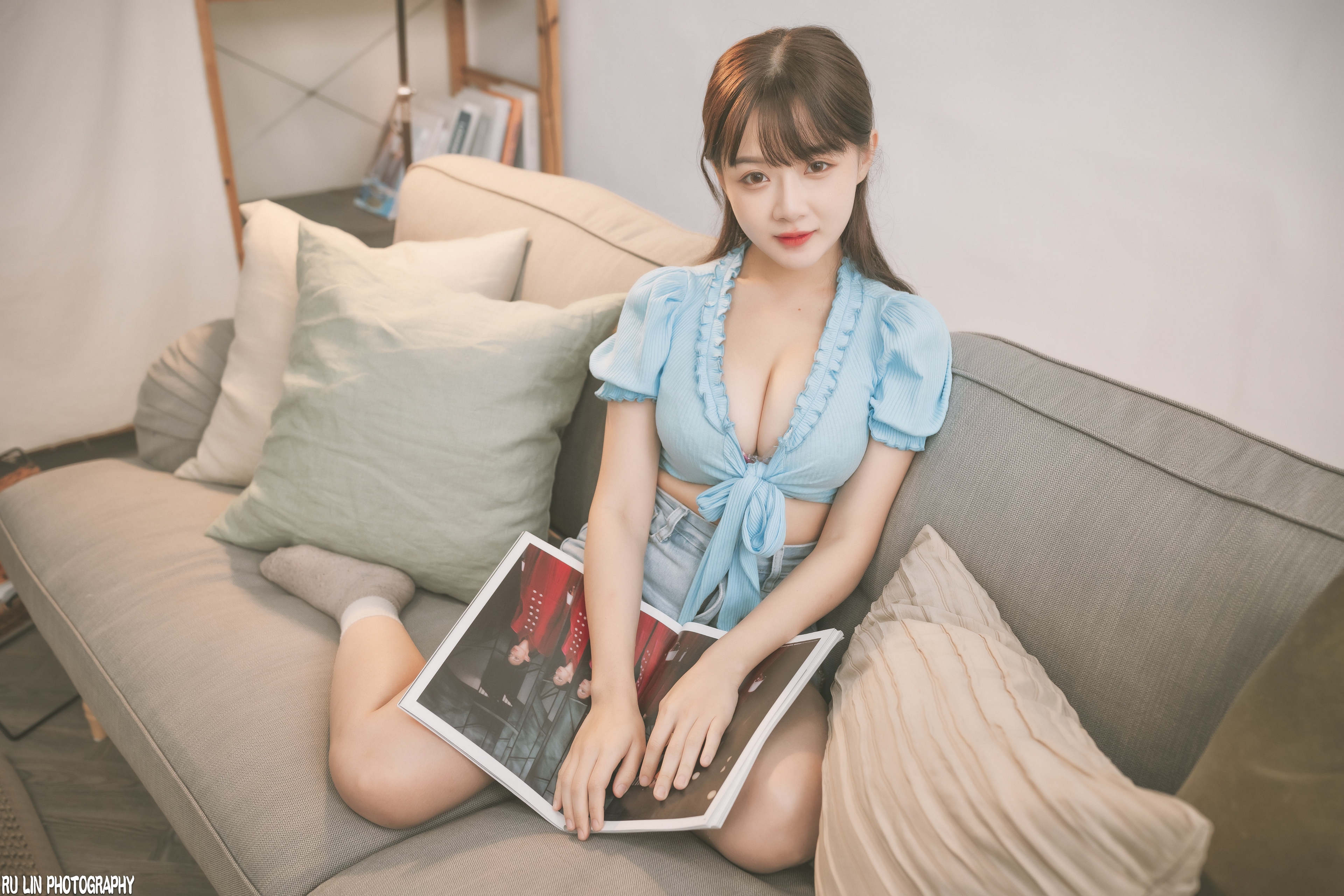 People 3840x2560 Winnie Qian women model brunette bangs Asian looking at viewer blue tops cleavage jean shorts socks couch indoors women indoors Ru Lin portrait smiling Chinese Chinese model Chinese women