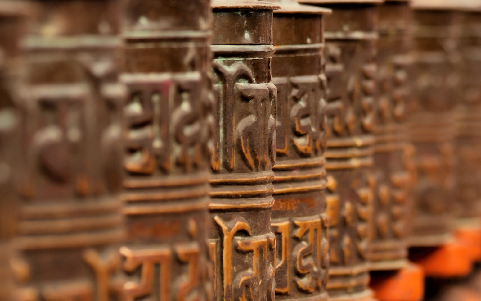 General 1550x969 prayer wheels Nepal Kathmandu Buddhism depth of field closeup