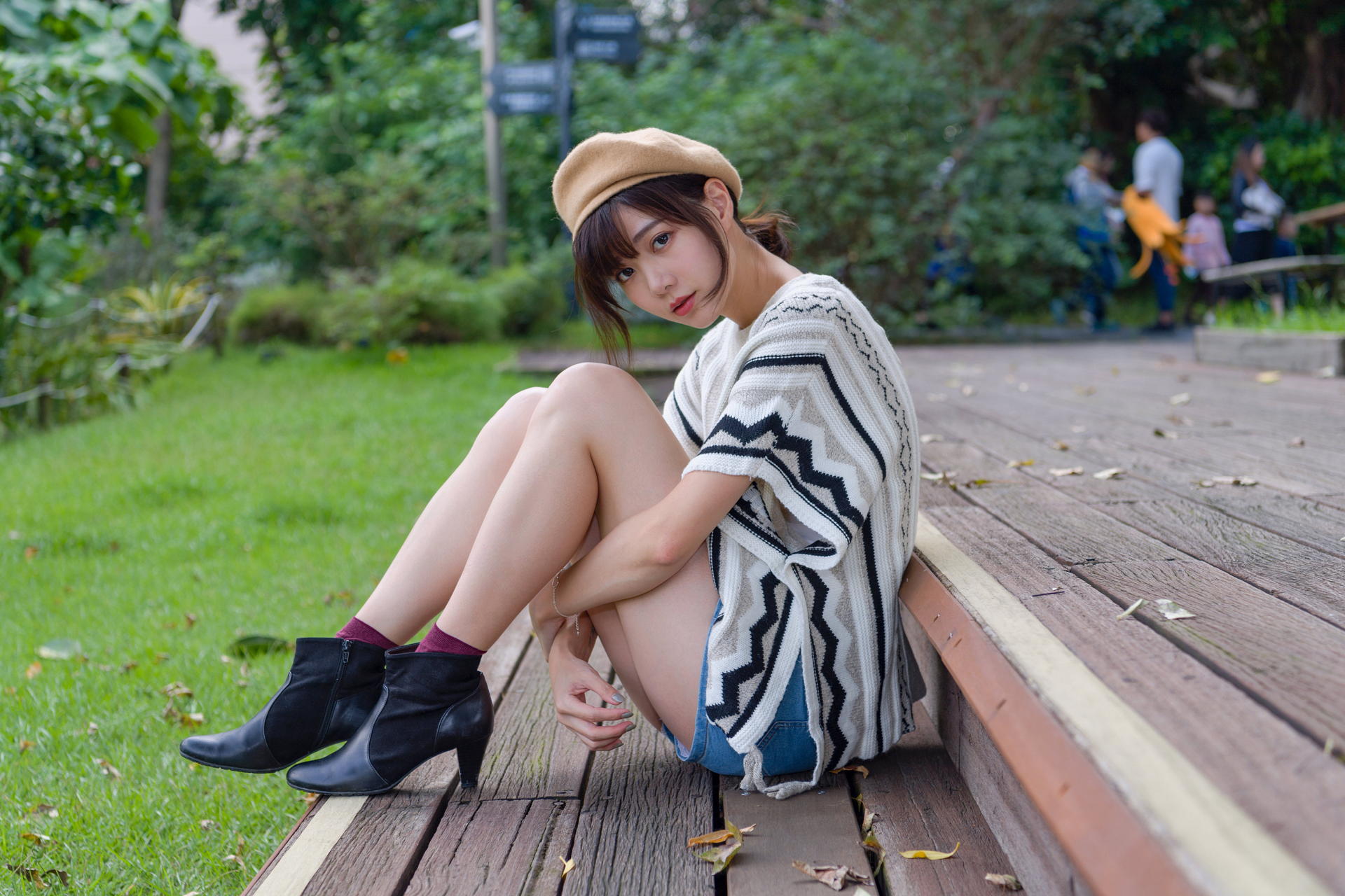 People 1920x1280 Asian model women long hair brunette sitting terraces berets jean shorts shirt depth of field bushes grass trees socks ponytail shoes red socks short socks bangs blunt bangs short sleeves arms under knees bent legs looking at viewer