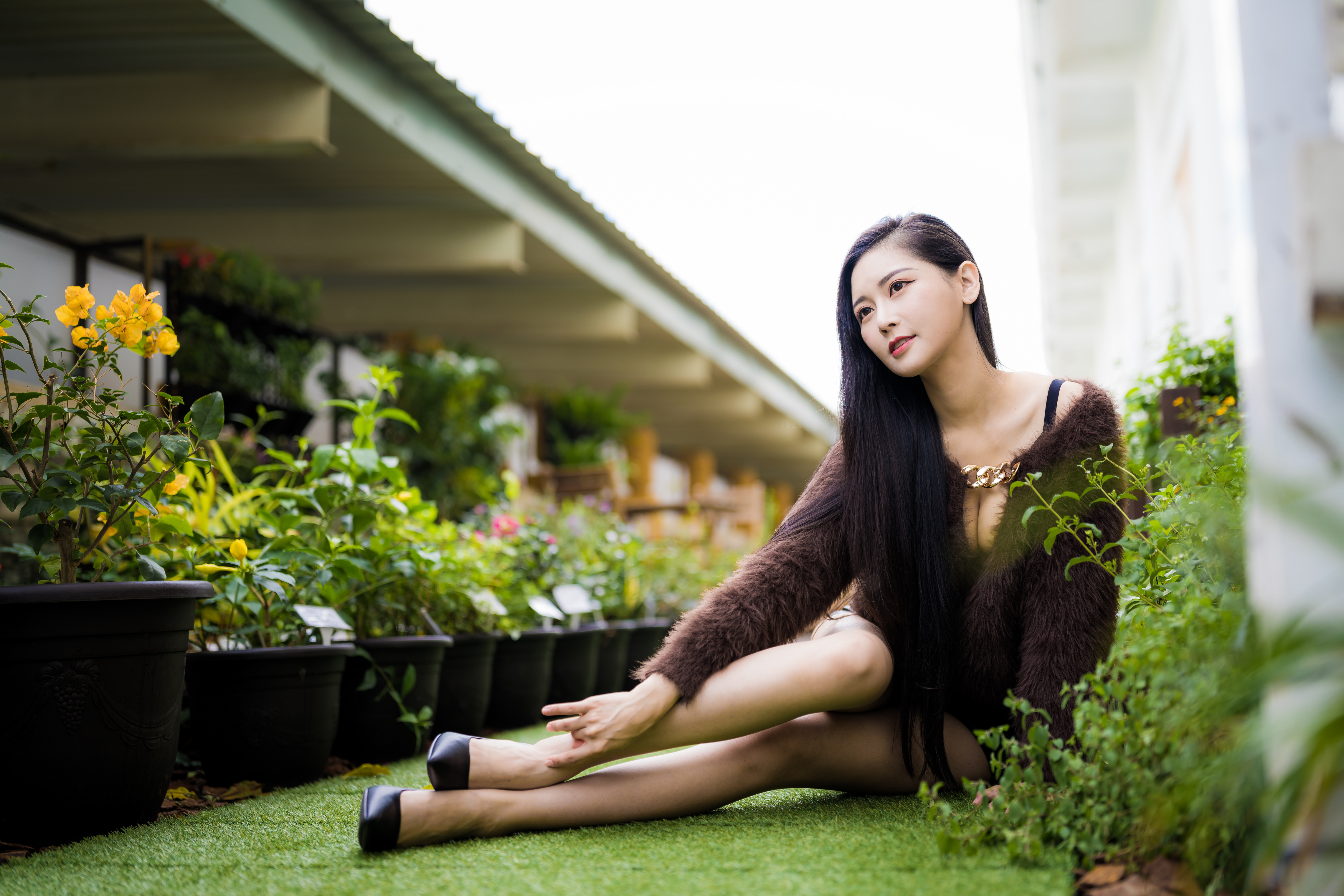 People 4562x3041 Asian model women long hair dark hair sitting depth of field bridge flowerpot plants black heels pullover cleavage flowers brunette