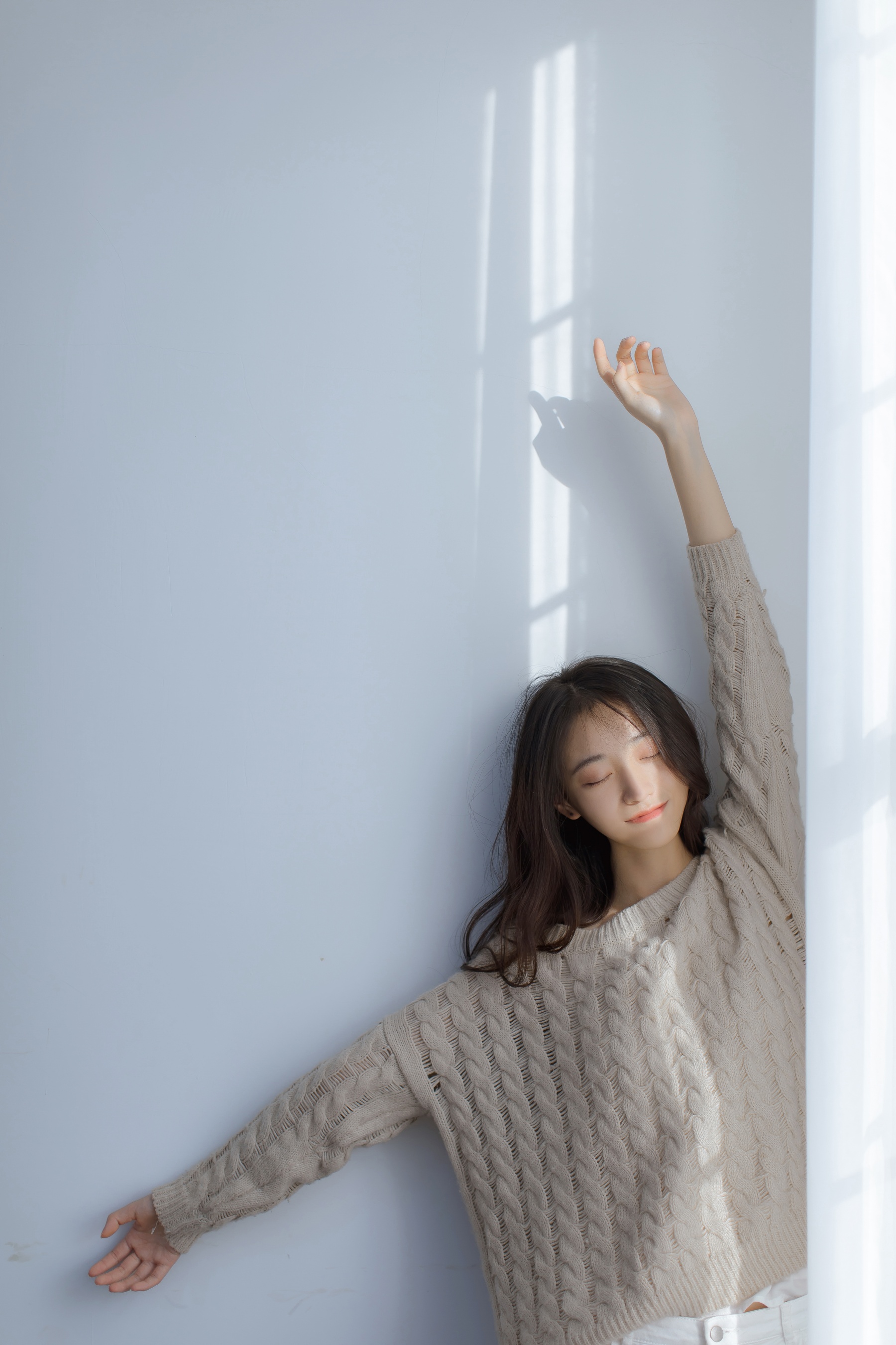 People 1800x2700 women model Asian Chinese model long hair dark hair women indoors sweater closed eyes closed mouth portrait display indoors sunlight smiling wall by the wall