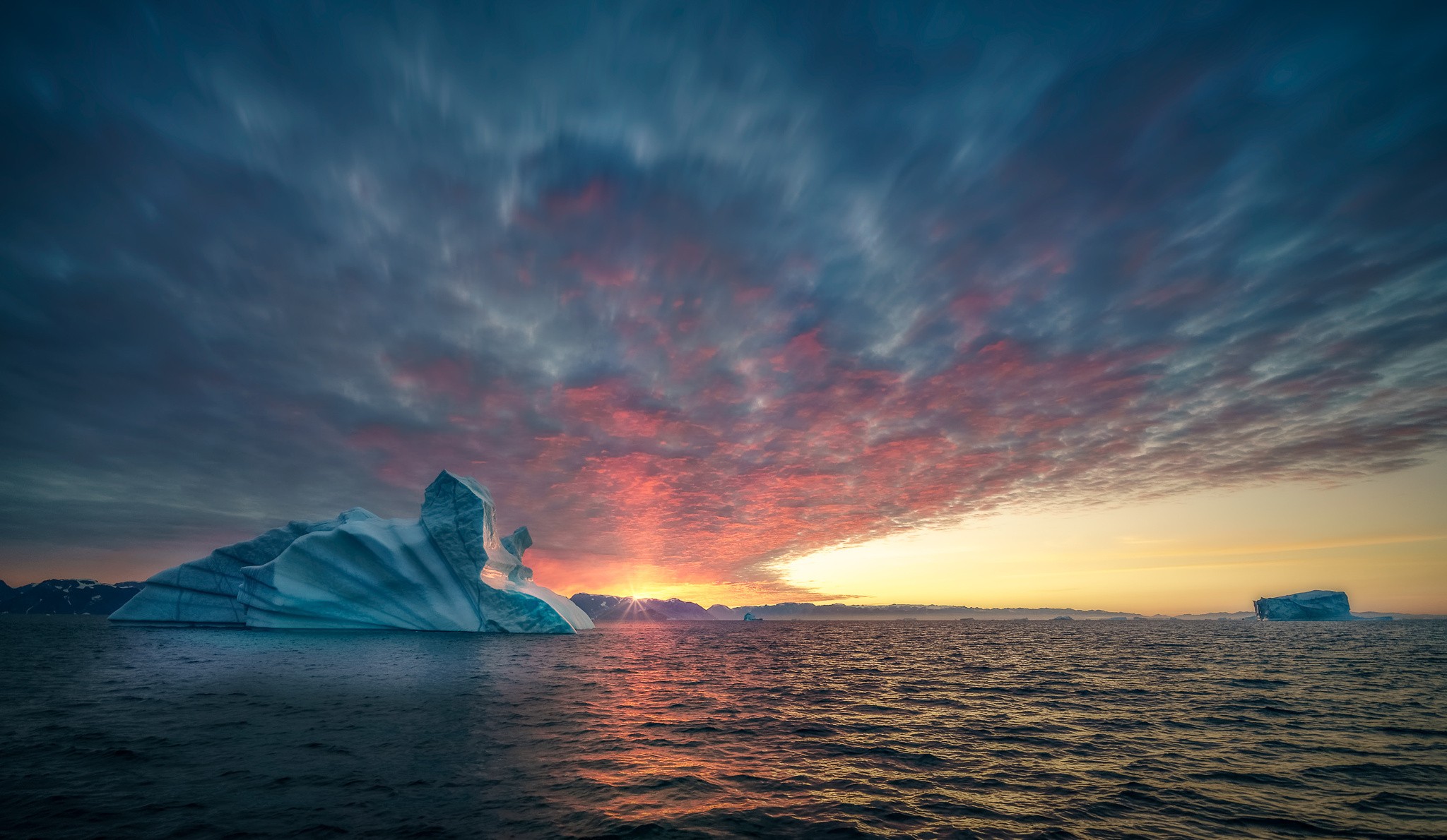 General 2048x1190 landscape ice clouds sea iceberg waves water sunset Sun sky nature