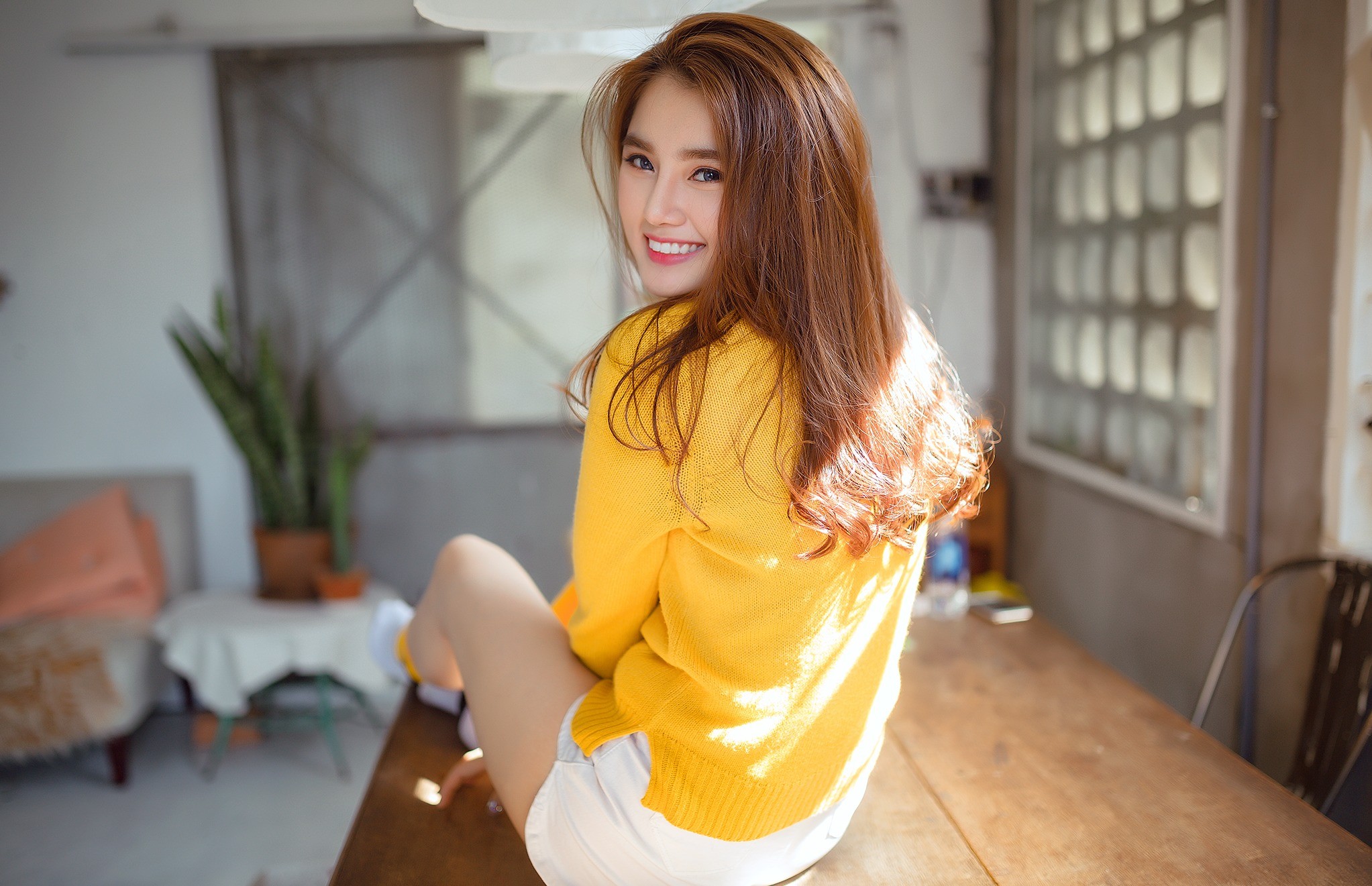 People 2045x1321 Asian women smiling model women indoors long hair brunette dyed hair sitting table sweater yellow sweater