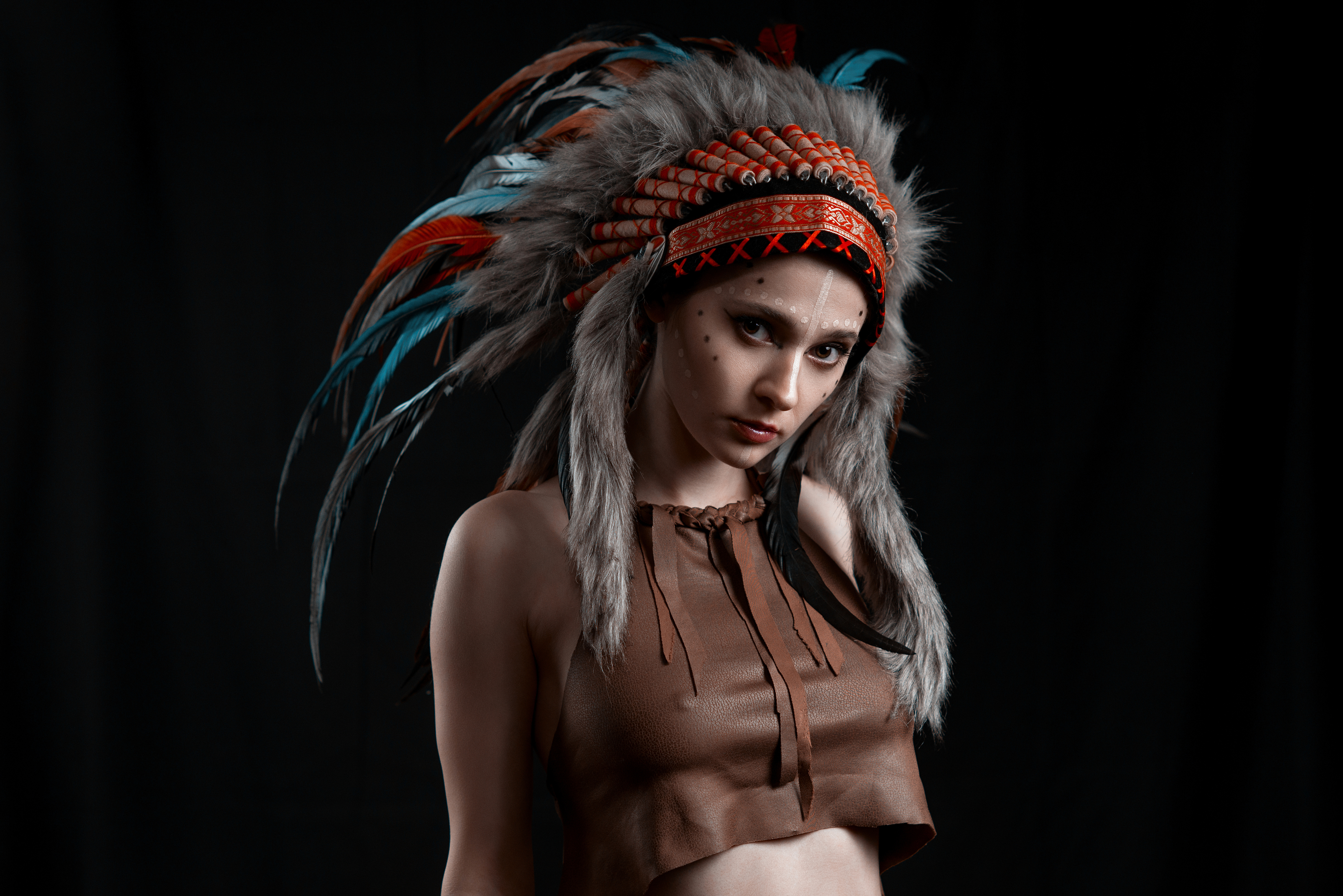 People 3500x2336 Leeloush Keer women Native American clothing makeup brown clothing nipple bulge feathers black background portrait face paint low light simple background