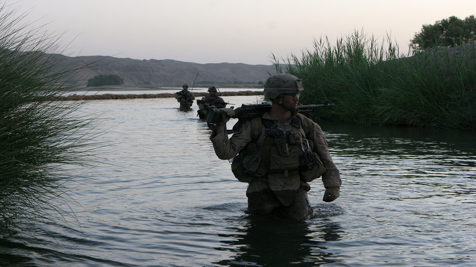 People 1600x900 United States Marine Corps M240 War in Afghanistan military water standing in water uniform gun helmet looking away