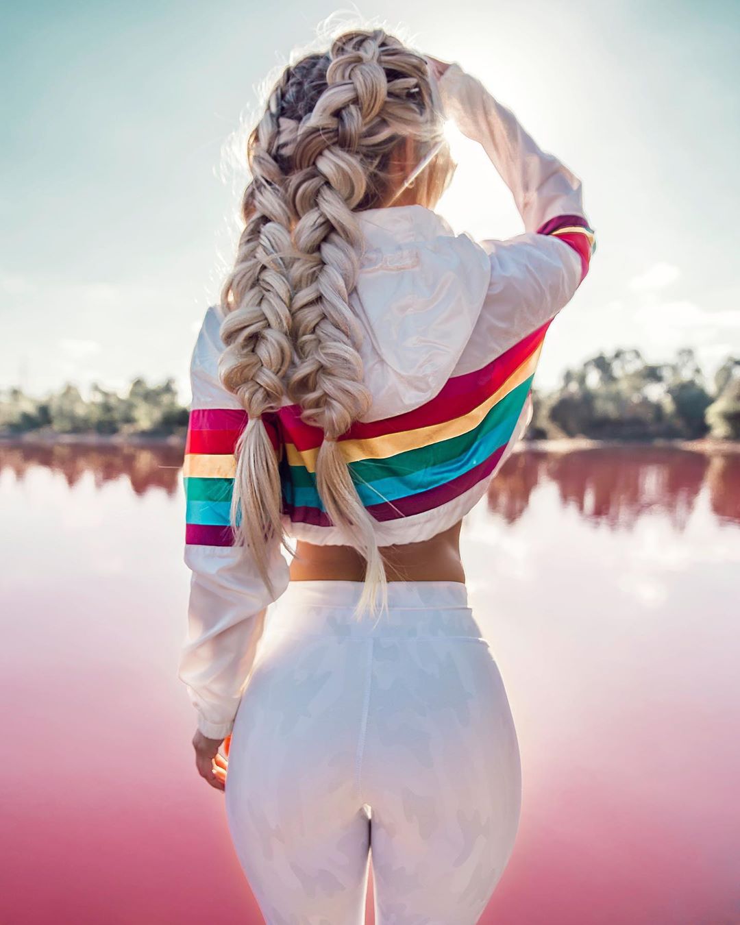People 1080x1350 women model blonde braids portrait display standing women outdoors natural light white clothing touching hair colorful rainbow clothing tight clothing lake water bokeh long hair sunlight jacket white jacket earring bare midriff Hilde Osland rear view hips