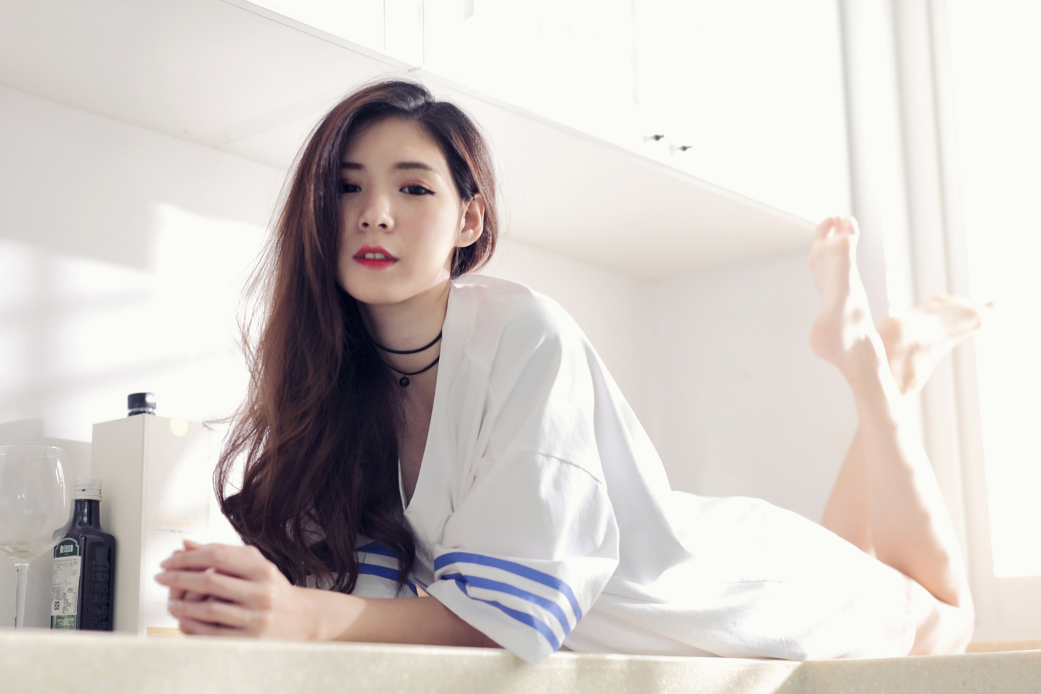 People 2048x1366 women model Asian brunette looking at viewer portrait indoors T-shirt kitchen lying on front feet in the air necklace women indoors