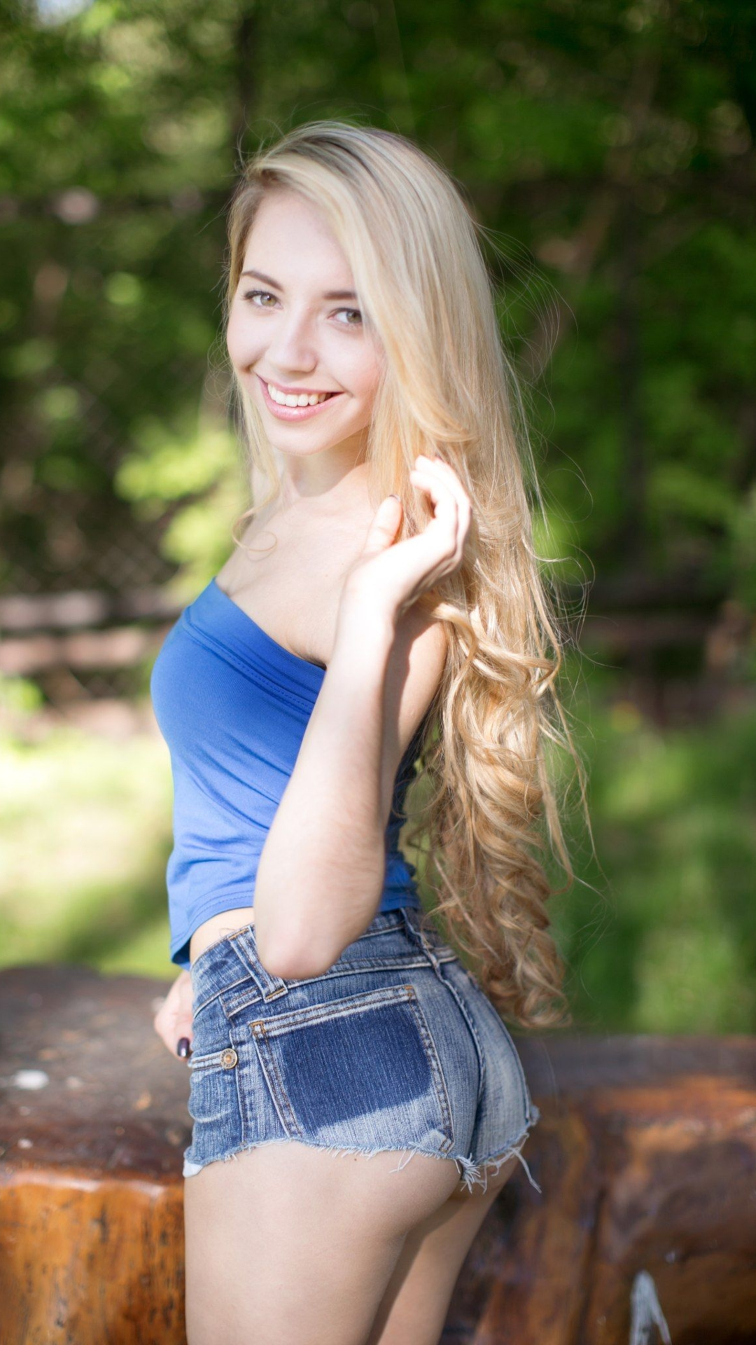 People 1080x1920 women Ukrainian smiling blonde long hair jean shorts short shorts ass looking over shoulder women outdoors depth of field