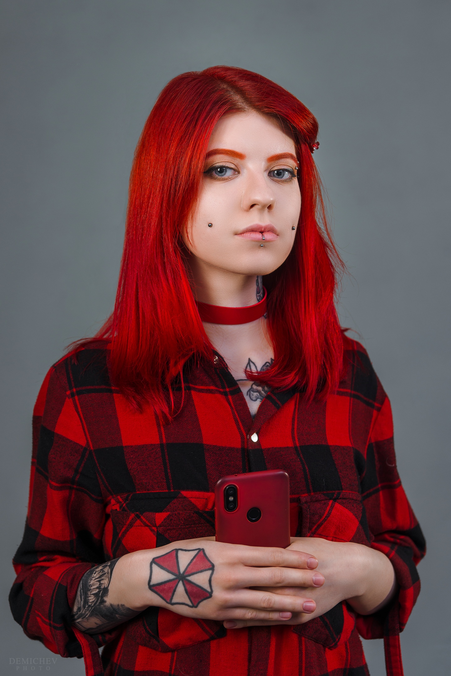 People 1440x2160 women model indoors women indoors Petr Demichev redhead long hair piercing gray background studio looking at viewer dyed hair plaid shirt shirt plaid clothing inked girls smartphone pierced lip tattoo Umbrella Corporation Vera Faith dimple piercings portrait display simple background watermarked