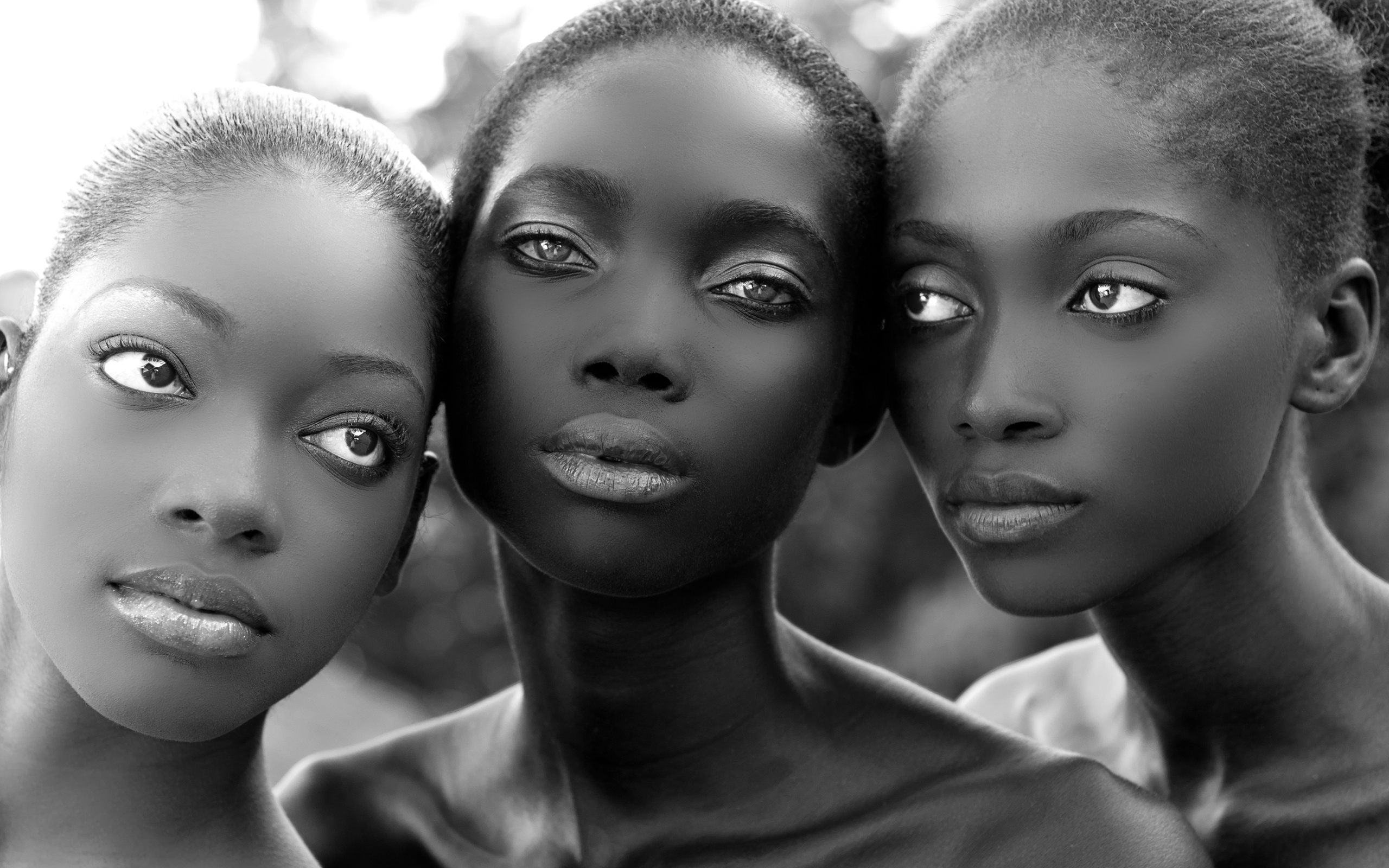 People 2560x1600 monochrome model looking at viewer looking away depth of field women group of women dark skin women trio brunette juicy lips bare shoulders portrait