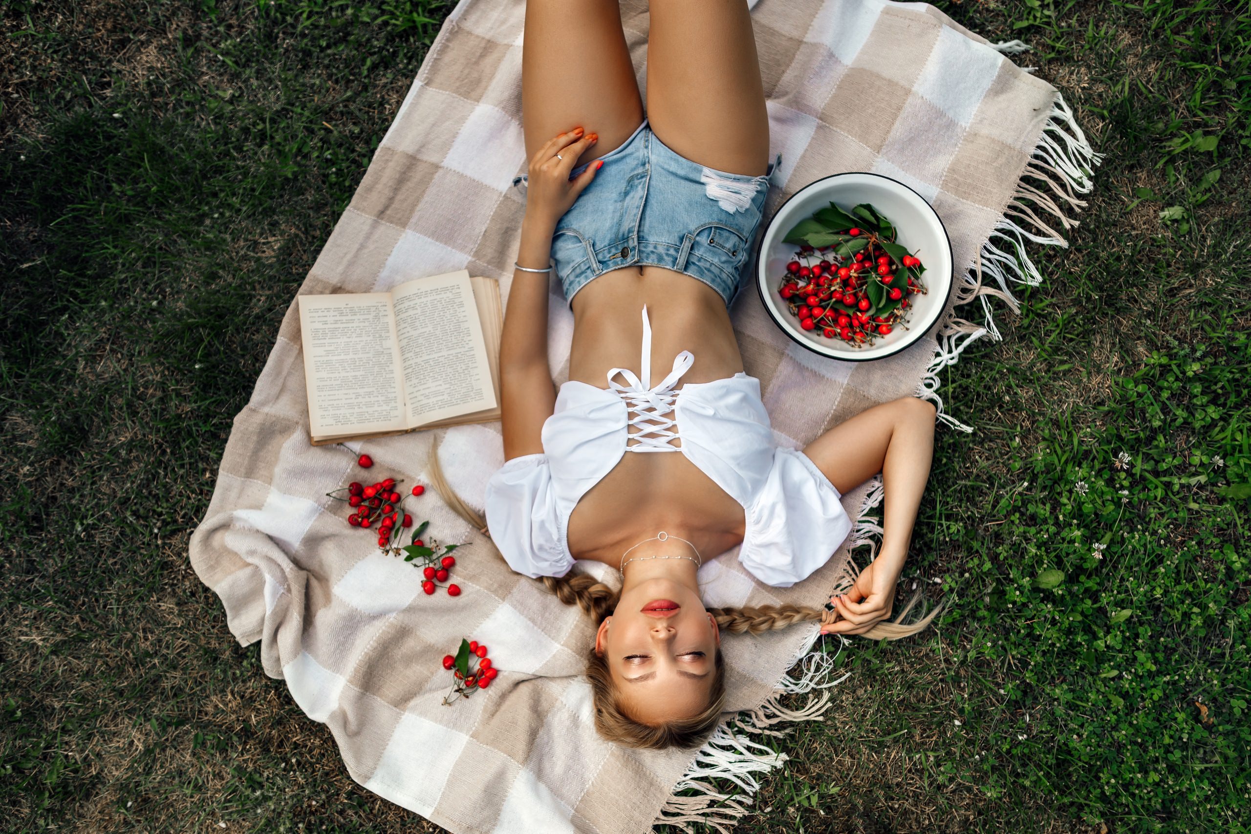 People 2560x1707 women top view blonde jean shorts belly grass books closed eyes twintails ribs painted nails women outdoors lying on back Nikolay Novikov Nika Gikalyuk lace up top blue shorts short shorts