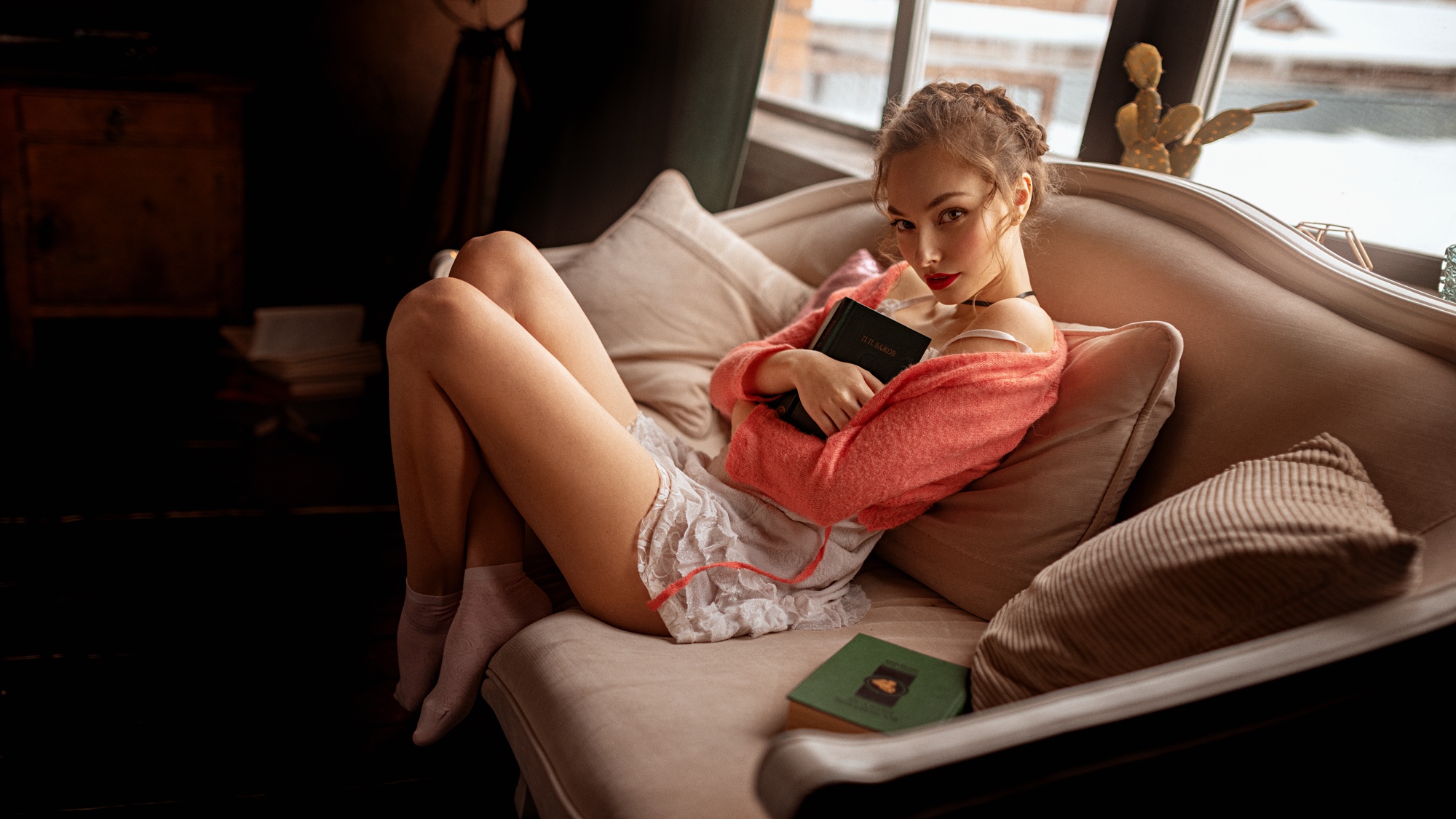 People 2000x1125 women model brunette braids looking at viewer red lipstick sweater pink sweater dress white dress sitting socks white socks books cushions necklace arms crossed side view indoors women indoors Georgy Chernyadyev miniskirt choker legs up collar short socks feet crossed pointed toes bent legs young women