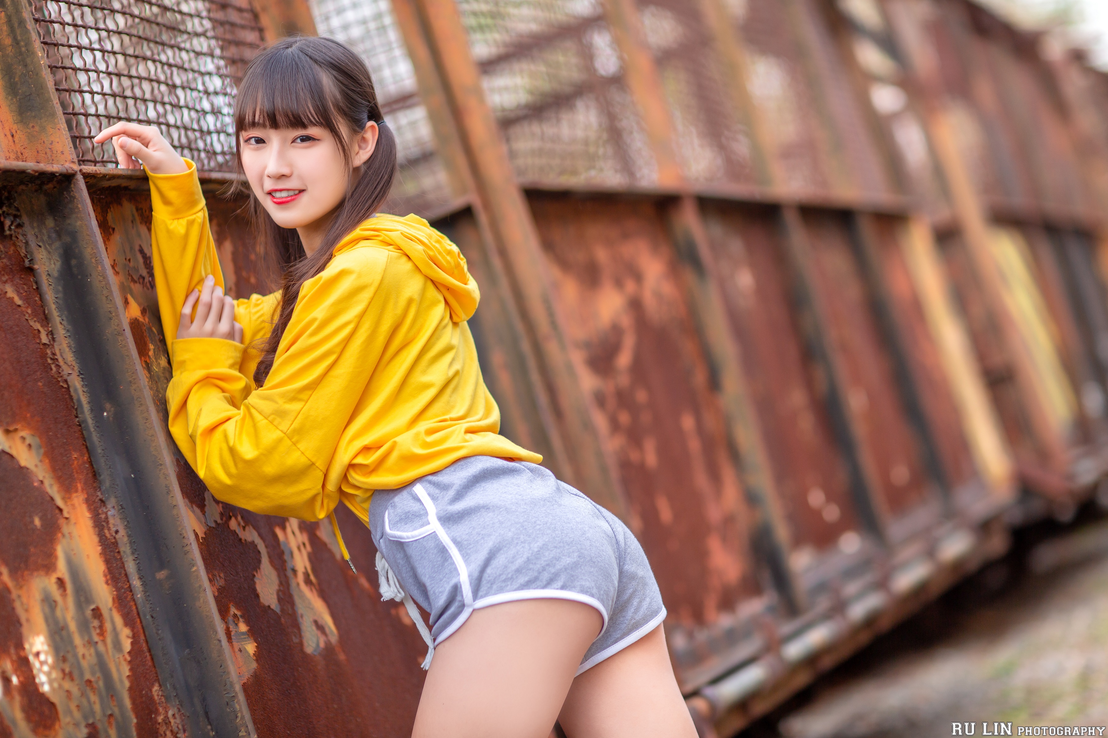 People 3600x2400 women model brunette Asian looking at viewer hoods sweatshirts short shorts portrait red lipstick smiling depth of field rust outdoors women outdoors twintails Angela Wei Ting