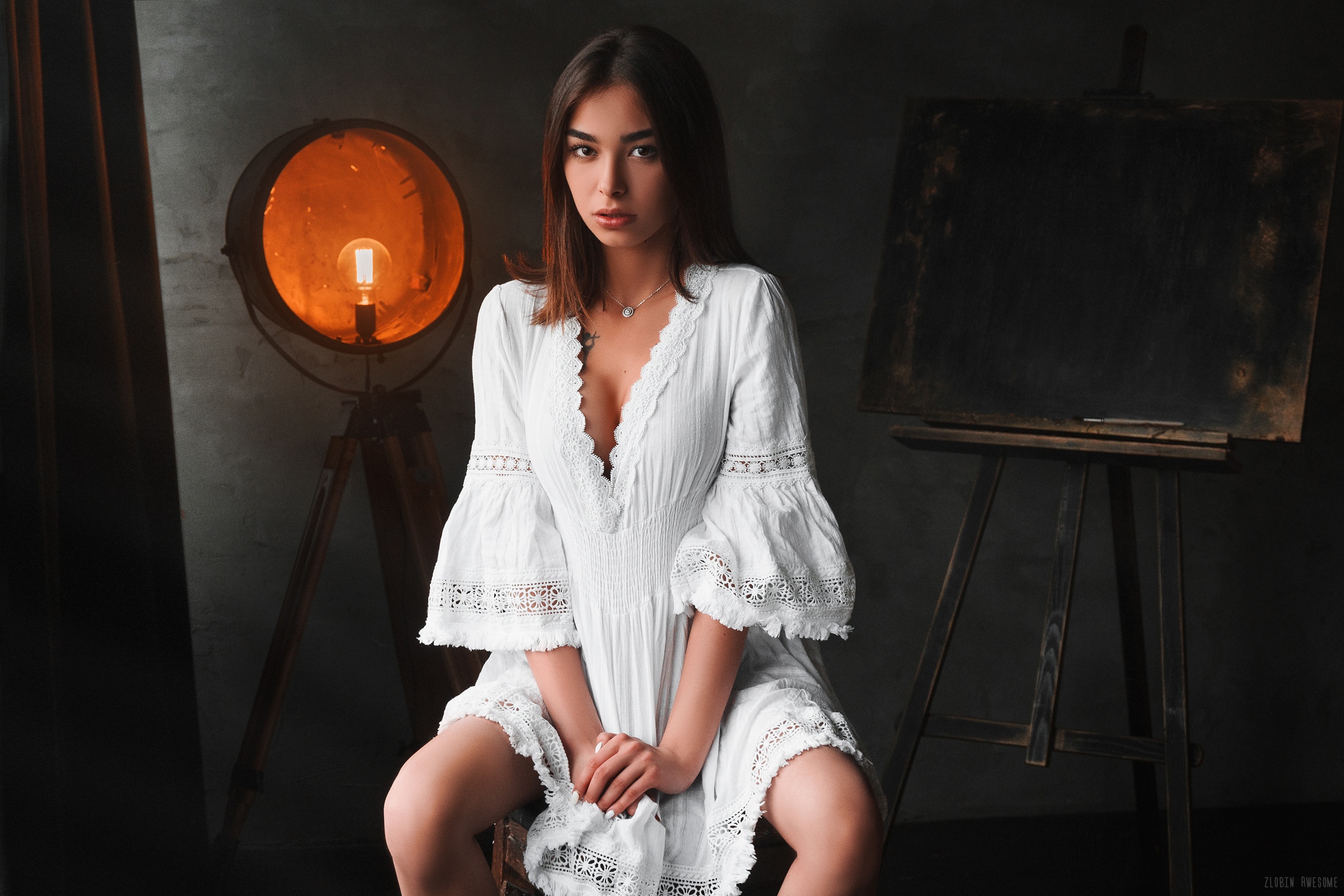 People 2200x1467 women white dress sitting light bulb cleavage tattoo necklace easel white nails Valery Zlobin women indoors indoors looking at viewer makeup spread legs Nana Gabe brown eyes parted lips