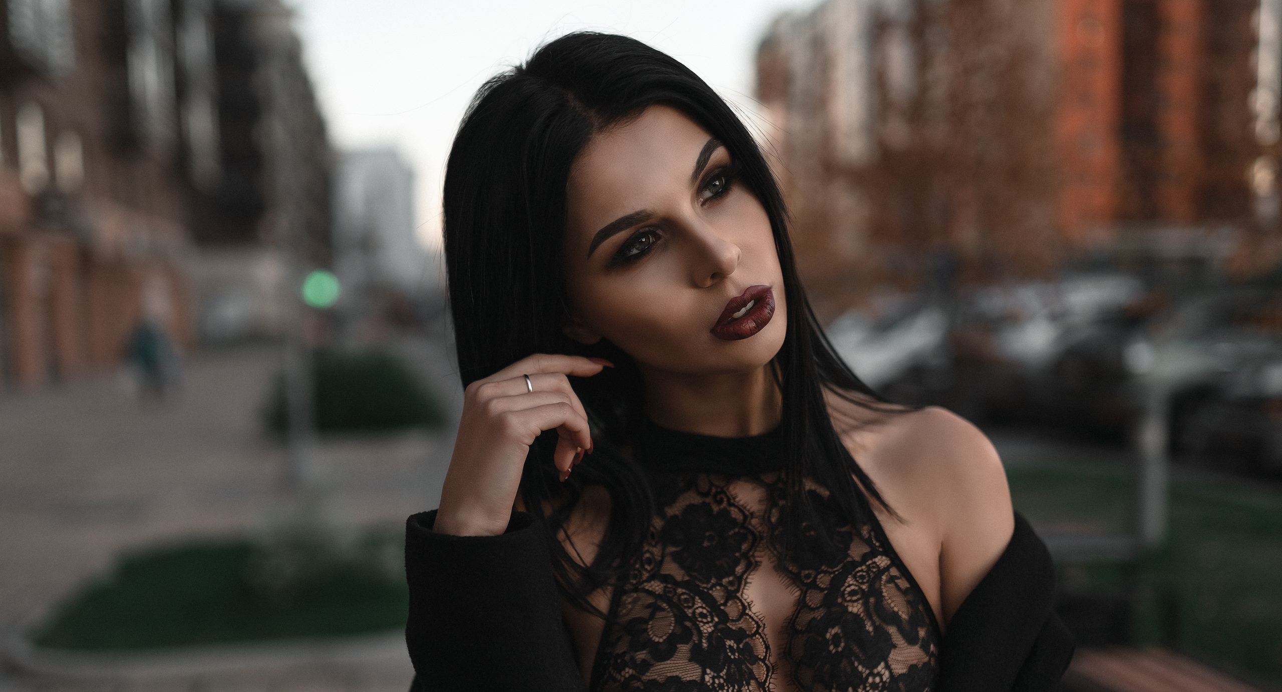 People 2560x1382 women portrait bare shoulders depth of field see-through clothing black hair makeup women outdoors juicy lips red nails red lipstick looking into the distance