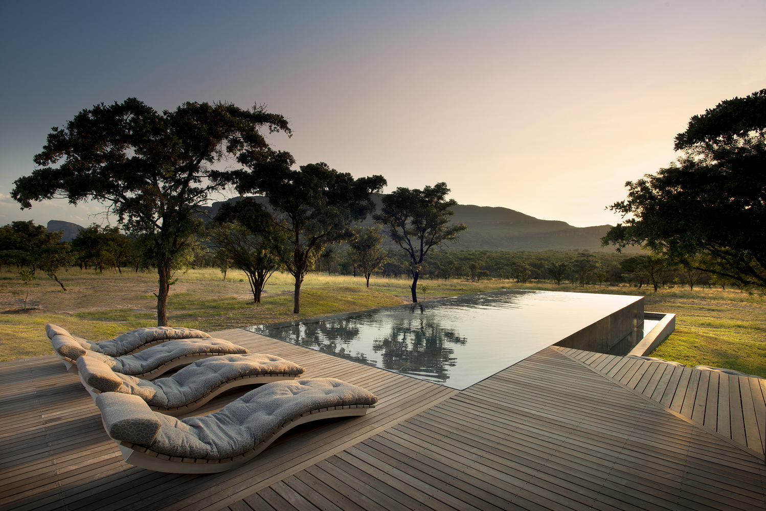 General 1498x1000 swimming pool South Africa trees outdoors mountains sunset