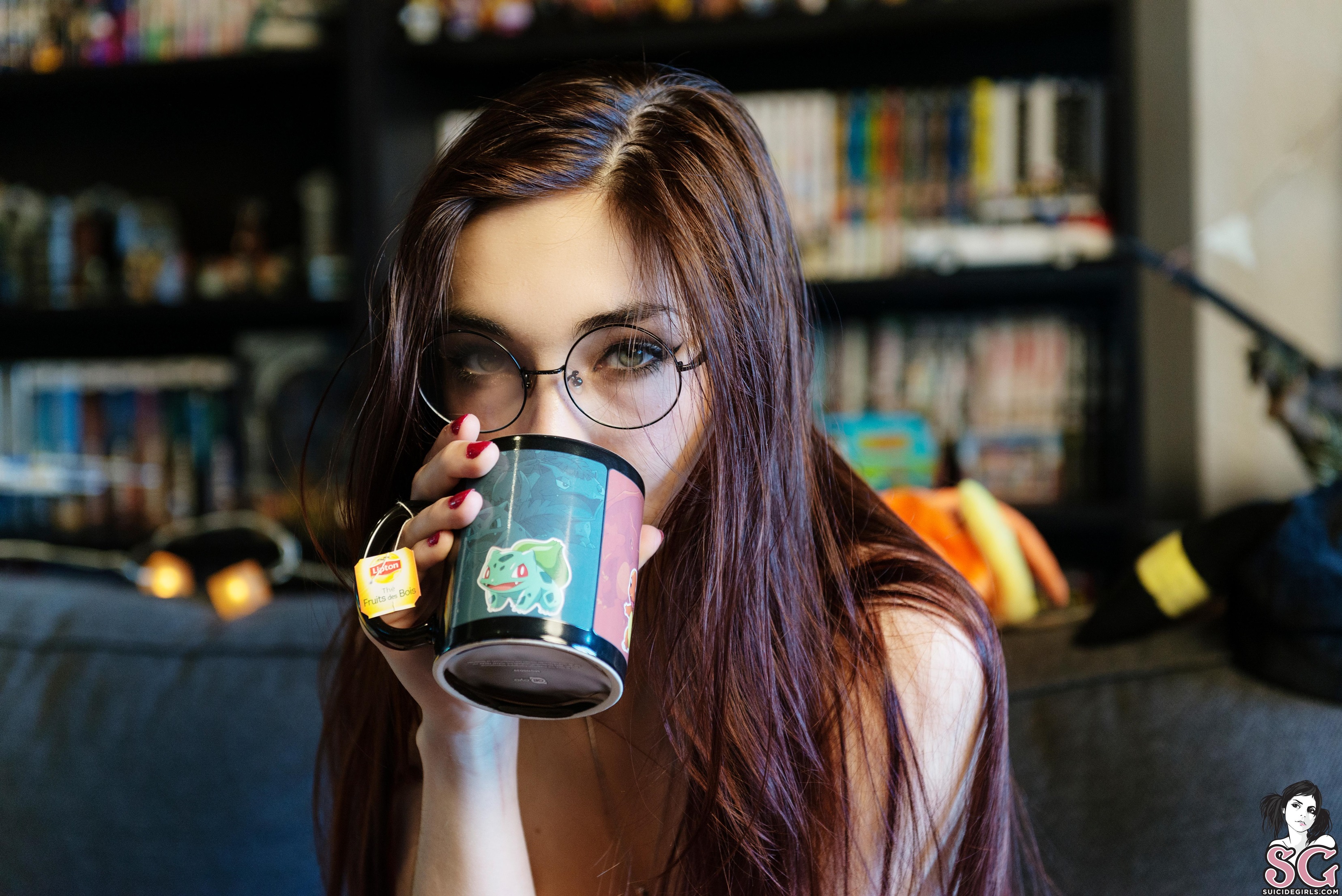 People 3309x2209 brunette Suicide Girls drink cup women with glasses women indoors model depth of field long hair sitting couch women bare shoulders red nails Bulbasaur green eyes face Laudam Suicide watermarked tea looking at viewer