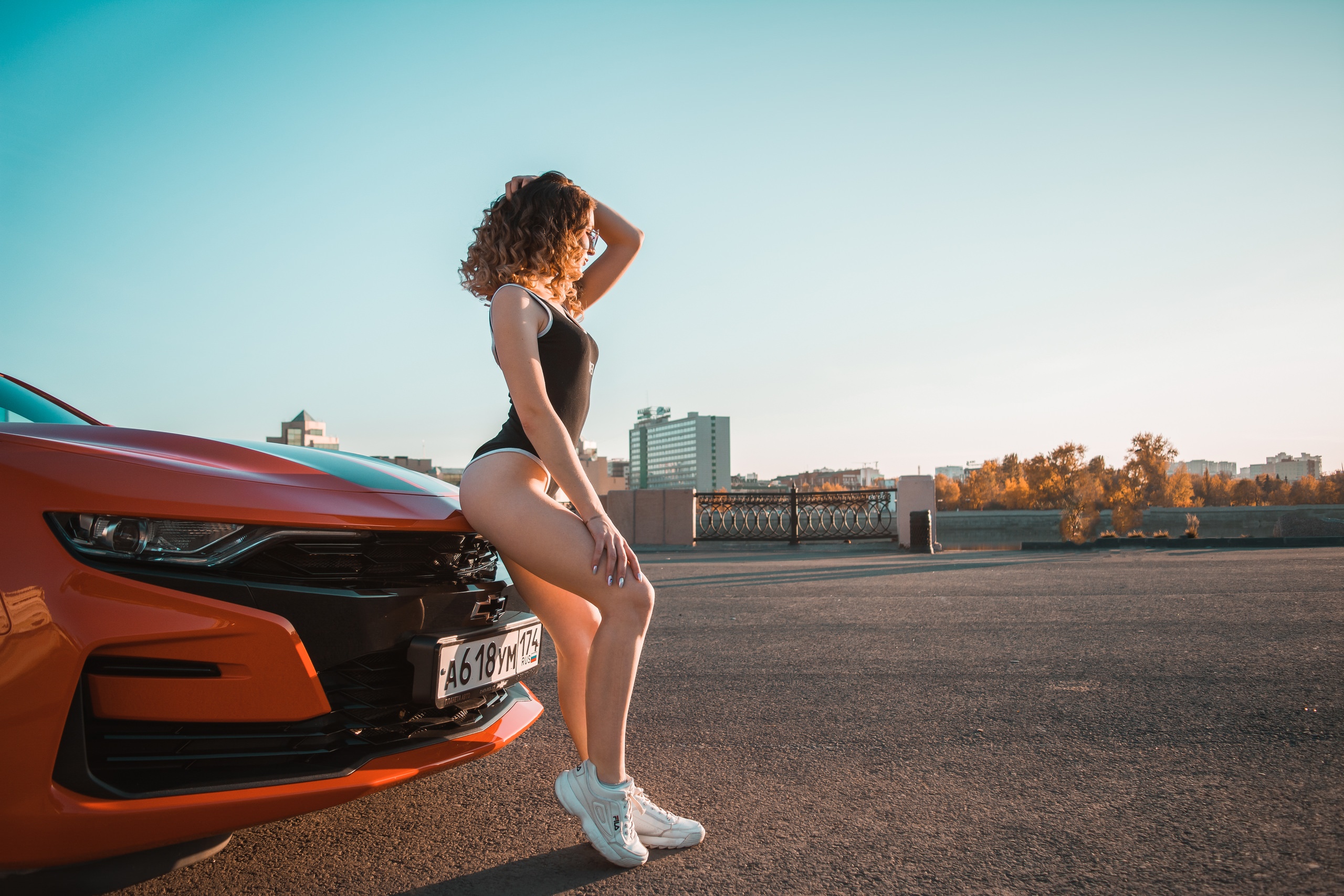 People 2560x1707 women women with cars ass sneakers Fila bodysuit curly hair women with glasses sky building women outdoors Chevrolet socks short socks white sneakers car Chevrolet Camaro muscle cars American cars