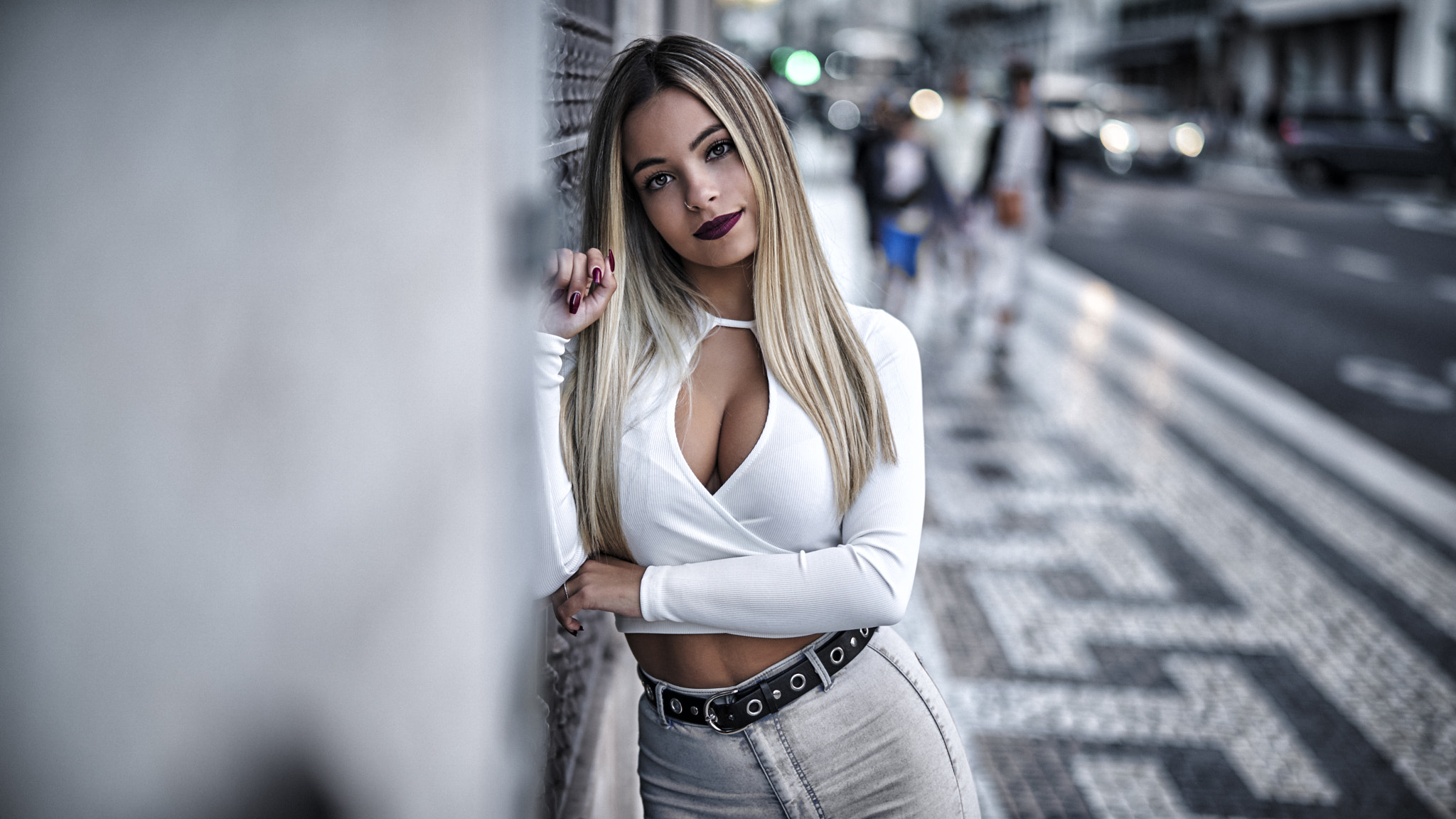 People 2048x1152 Pedro Courelas women blonde long hair straight hair makeup looking at viewer piercing pierced nose lipstick painted nails red nails smiling blouses white clothing cleavage belly belt jeans outdoors city sidewalks Alexandra Carocha