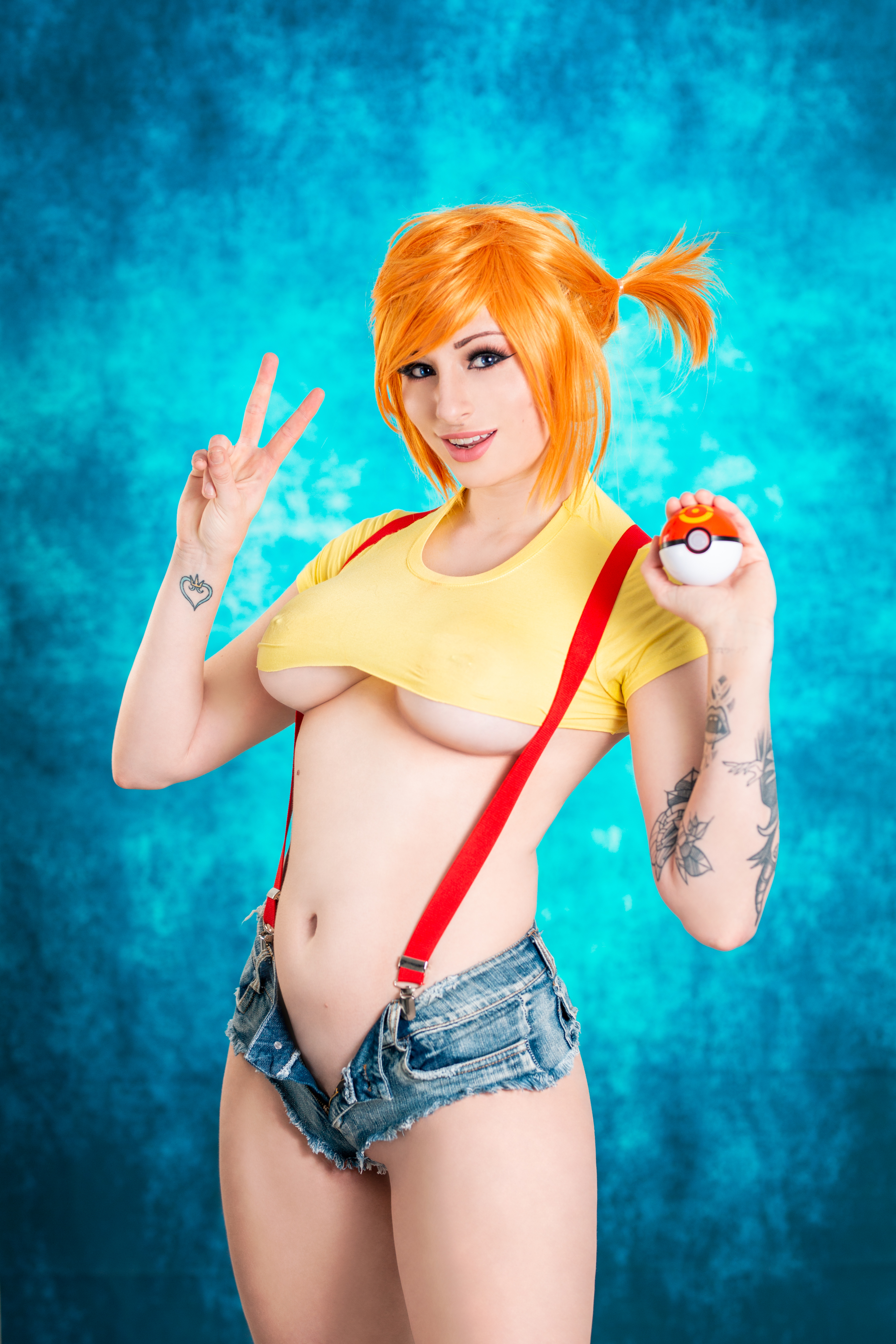People 3840x5760 Kayla Erin women model redhead looking at viewer smiling peace sign blue eyes short tops yellow tops belly suspenders no bra underboob nipples through clothing jean shorts open shorts shaved pubic hair tattoo Misty (Pokémon) Pokémon Poke Ball blue background indoors women indoors pierced nipples cyan high waisted shorts cosplay inked girls boobs
