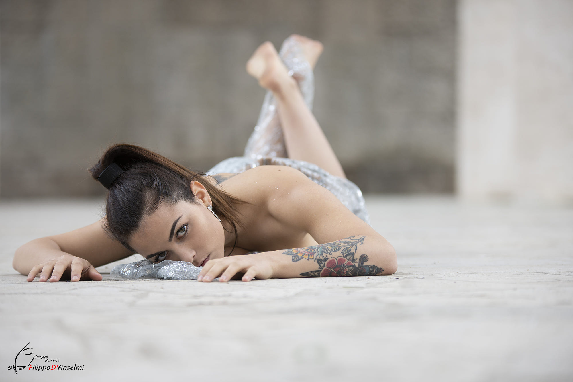 People 2000x1333 women model 500px brunette tattoo ponytail lying on front looking at viewer feet in the air feet depth of field