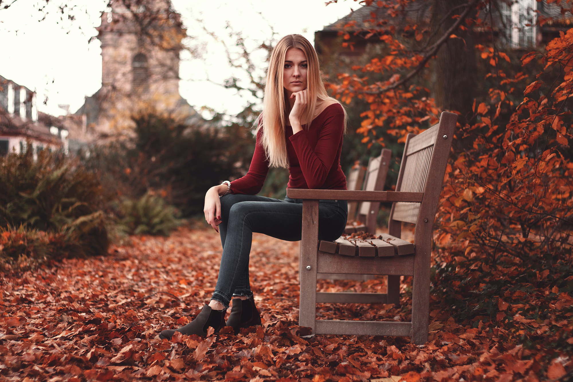 People 2000x1333 women blonde skinny jeans bench red leaves sitting looking at viewer red clothing straight hair long hair women outdoors on bench long sleeves red sweater