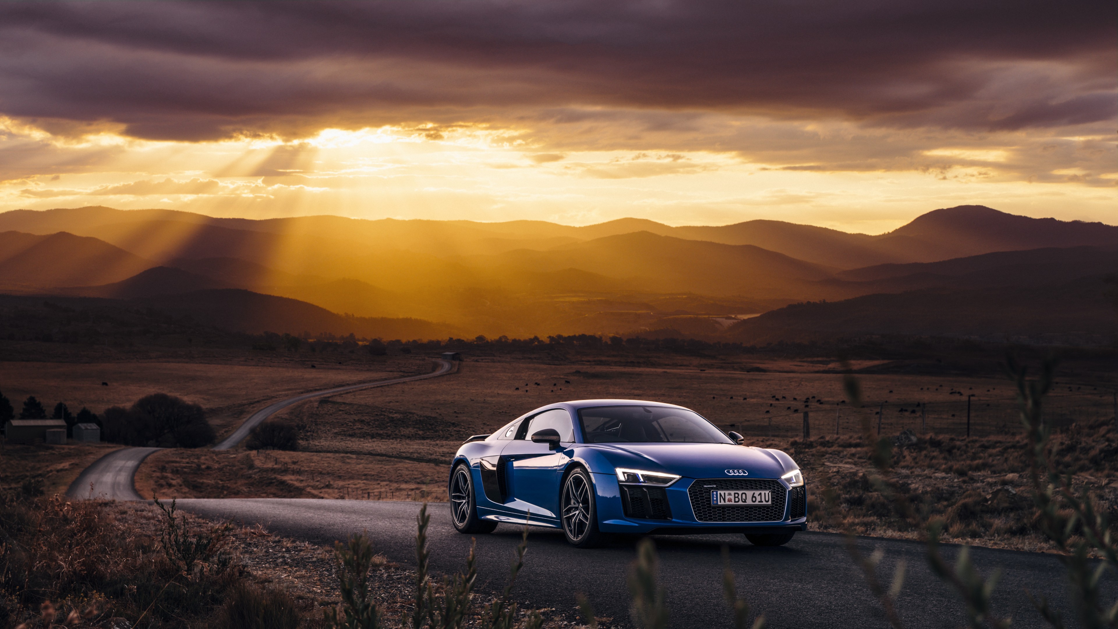 General 3840x2160 car sports car supercars landscape road clouds Audi Audi R8 field mountains hills sun rays plants blue cars vehicle frontal view