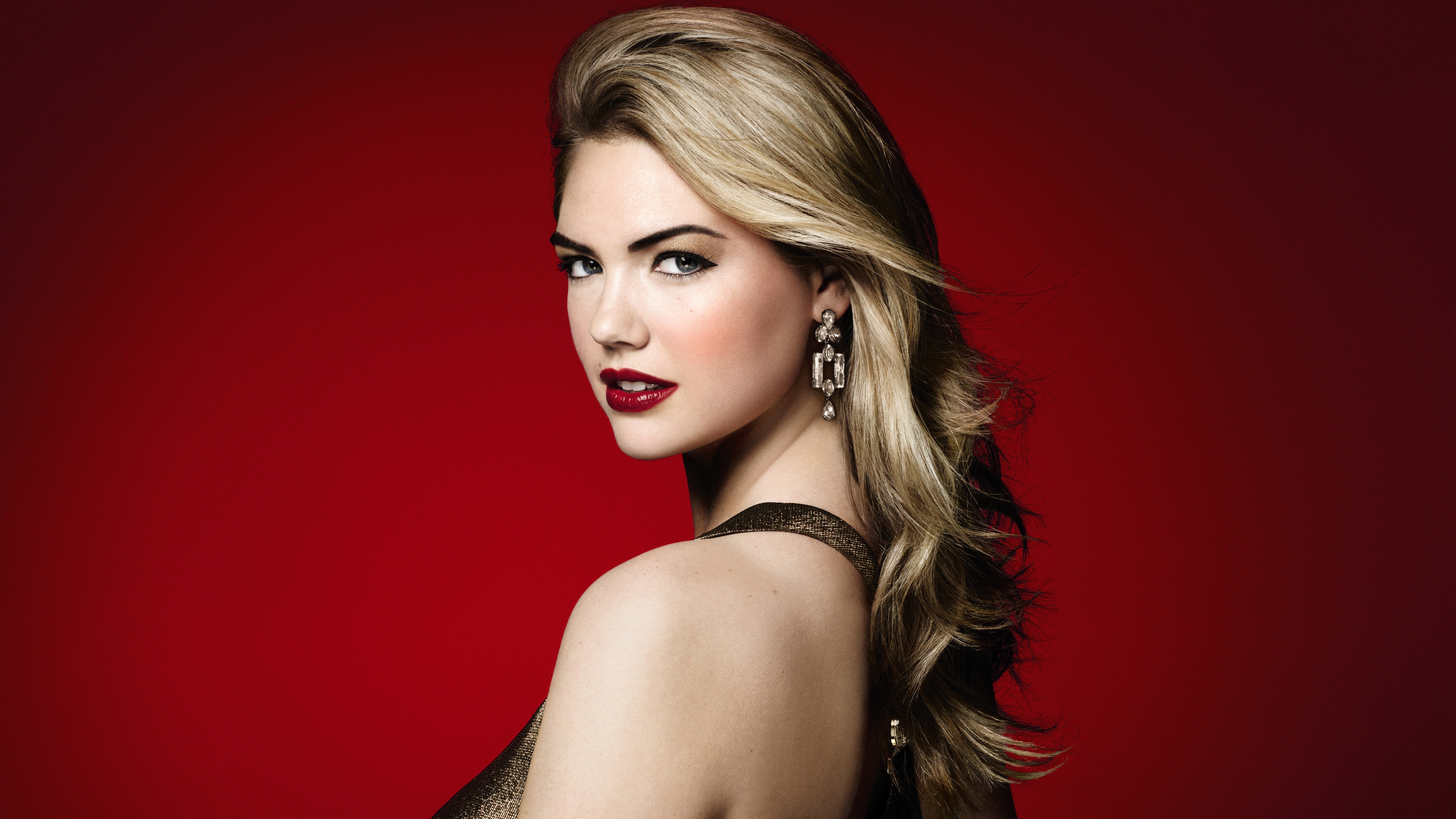 People 7680x4320 women Kate Upton looking at viewer blonde long hair earring red lipstick glamour red background classy gray eyes dress simple background model Australian women women indoors indoors studio makeup long earrings face portrait