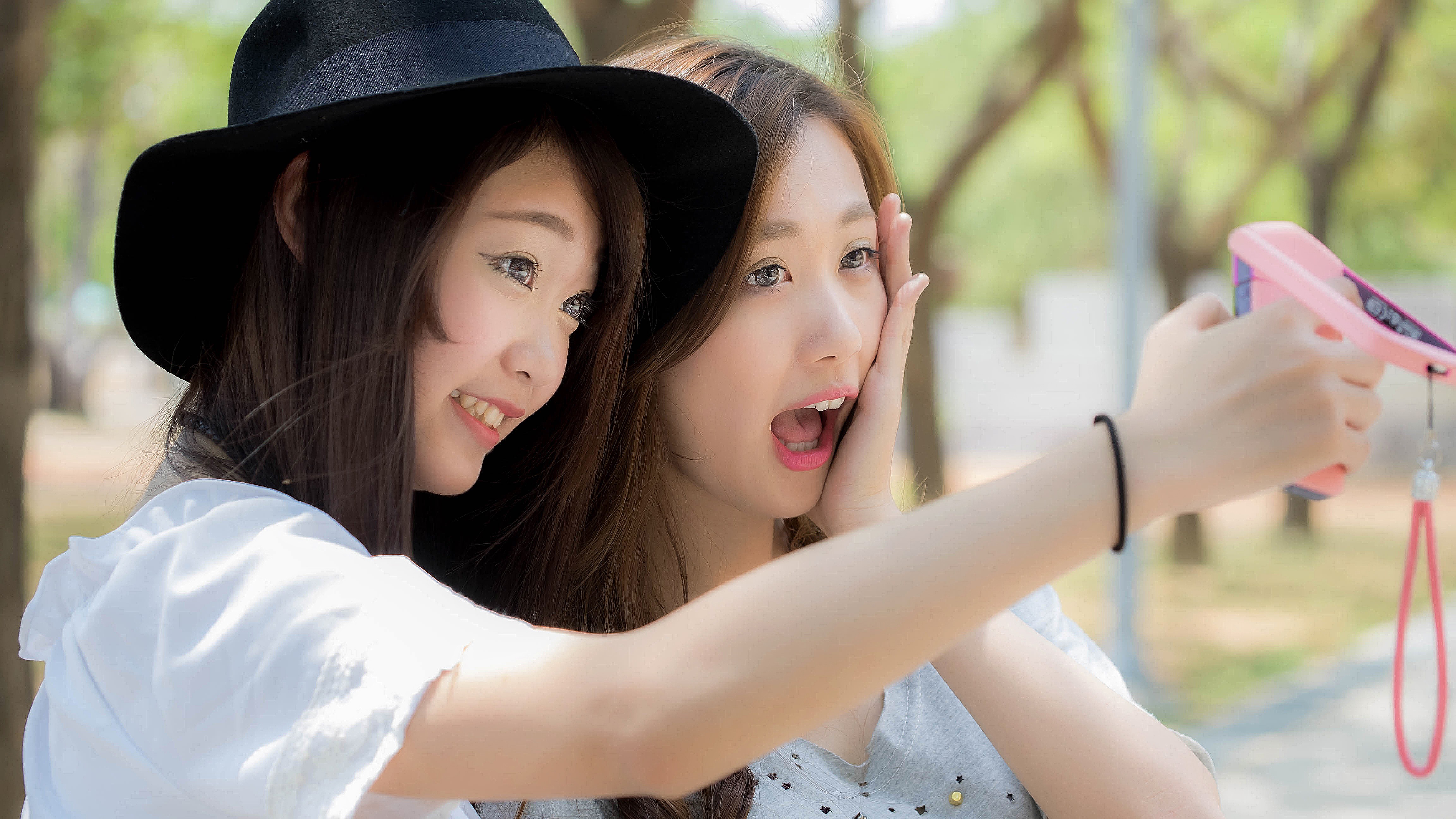 People 4608x2592 couple brunette millinery looking away women Asian model smartphone two women hat women with hats women outdoors open mouth selfies