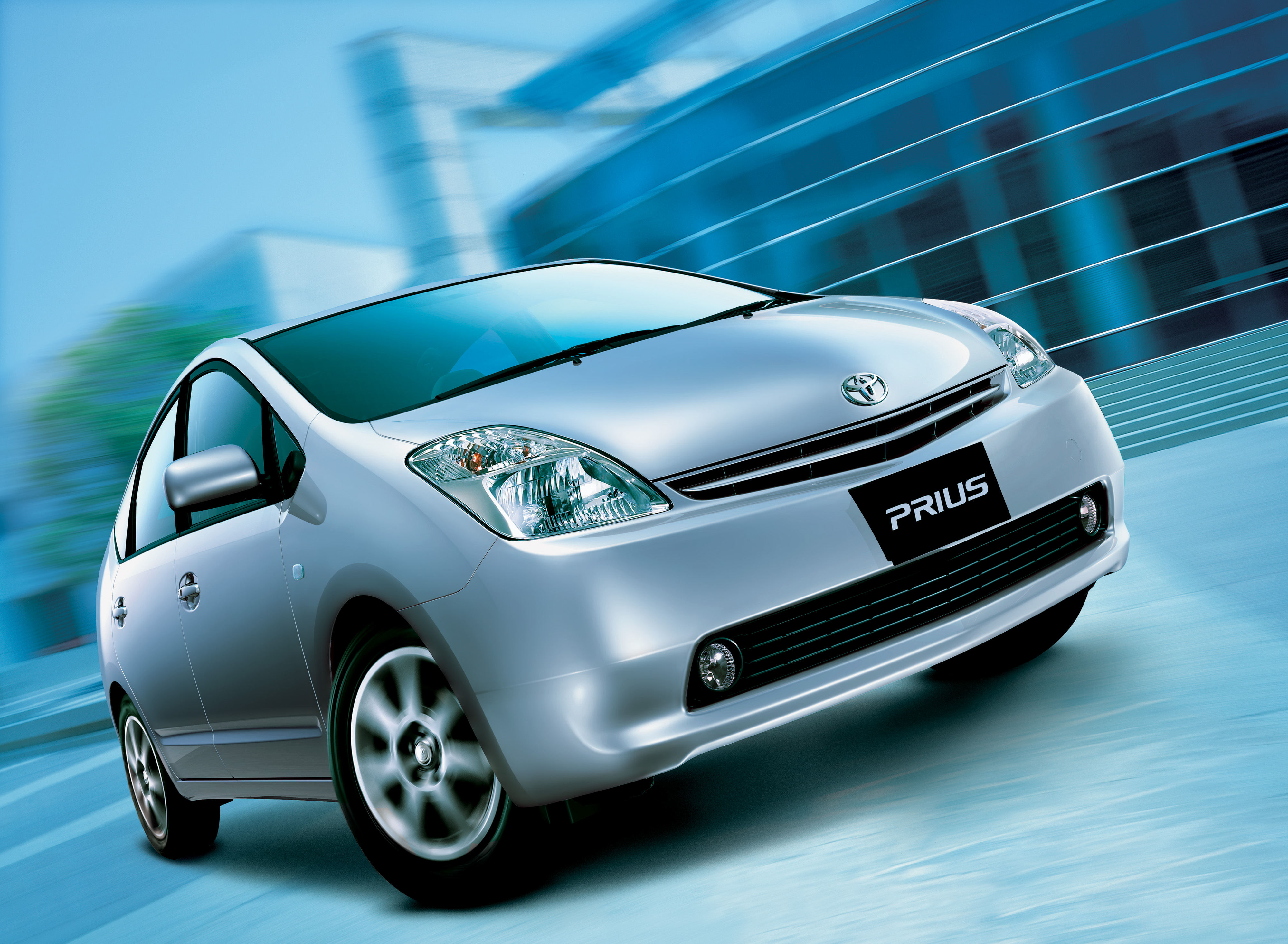 General 4000x2934 Toyota Toyota Prius hybrid (car) frontal view blurred blurry background vehicle car building silver cars