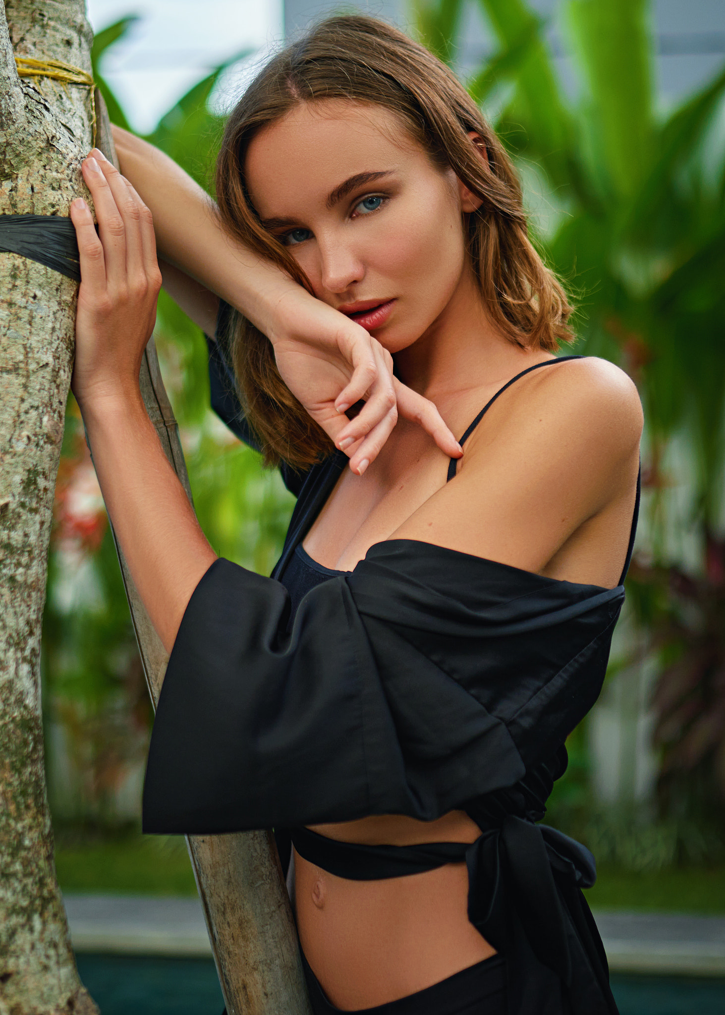 People 1463x2048 Sergey Zhirnov women brunette blue eyes looking at viewer dress black clothing tree bark plants tanned leaning bare shoulders thick eyebrows belly button