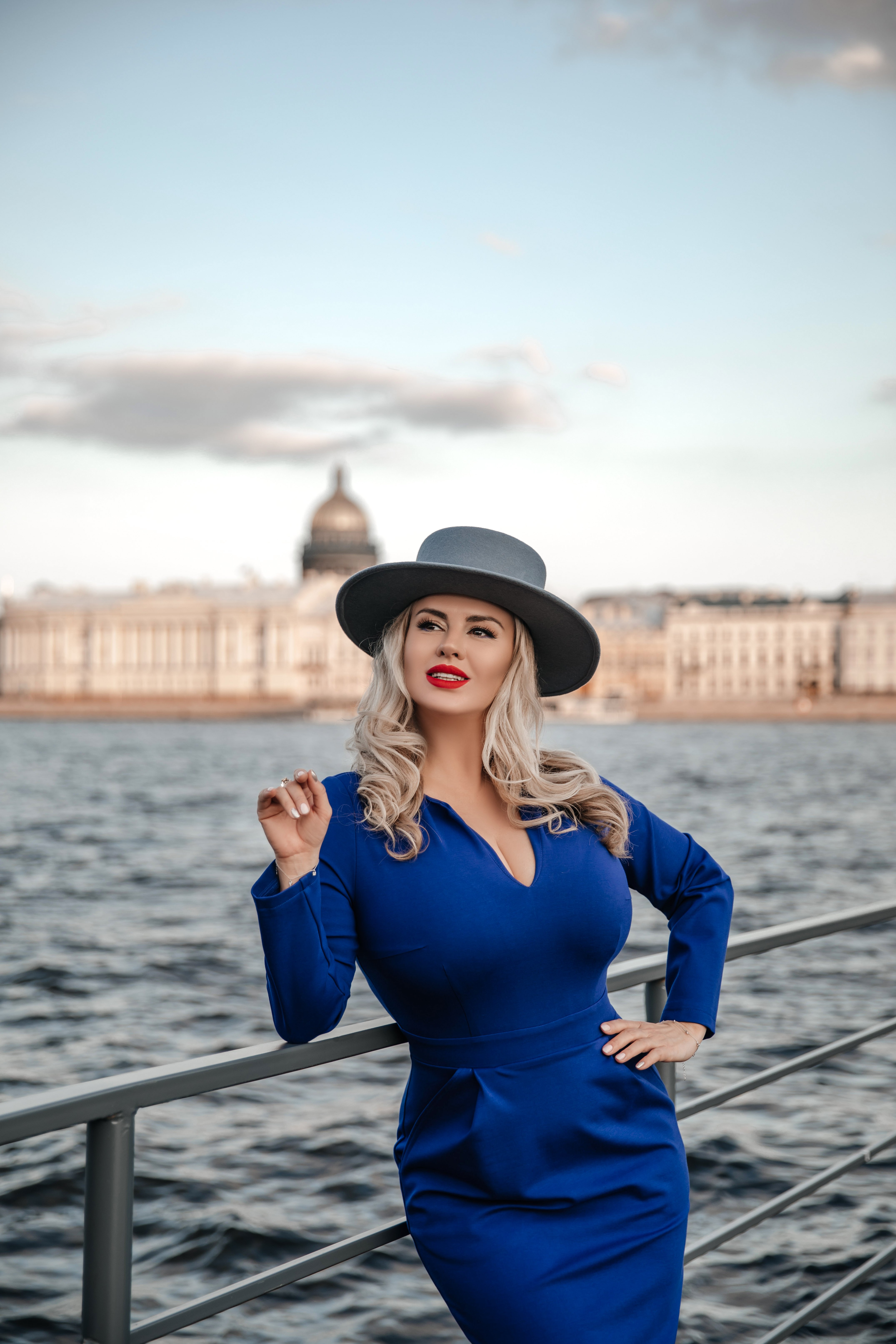 People 4301x6451 celebrity model women blonde portrait display Russian Russia St. Petersburg river Anna Semenovich outdoors women outdoors hands on hips water sky clouds hat women with hats curly hair looking away red lipstick lipstick parted lips