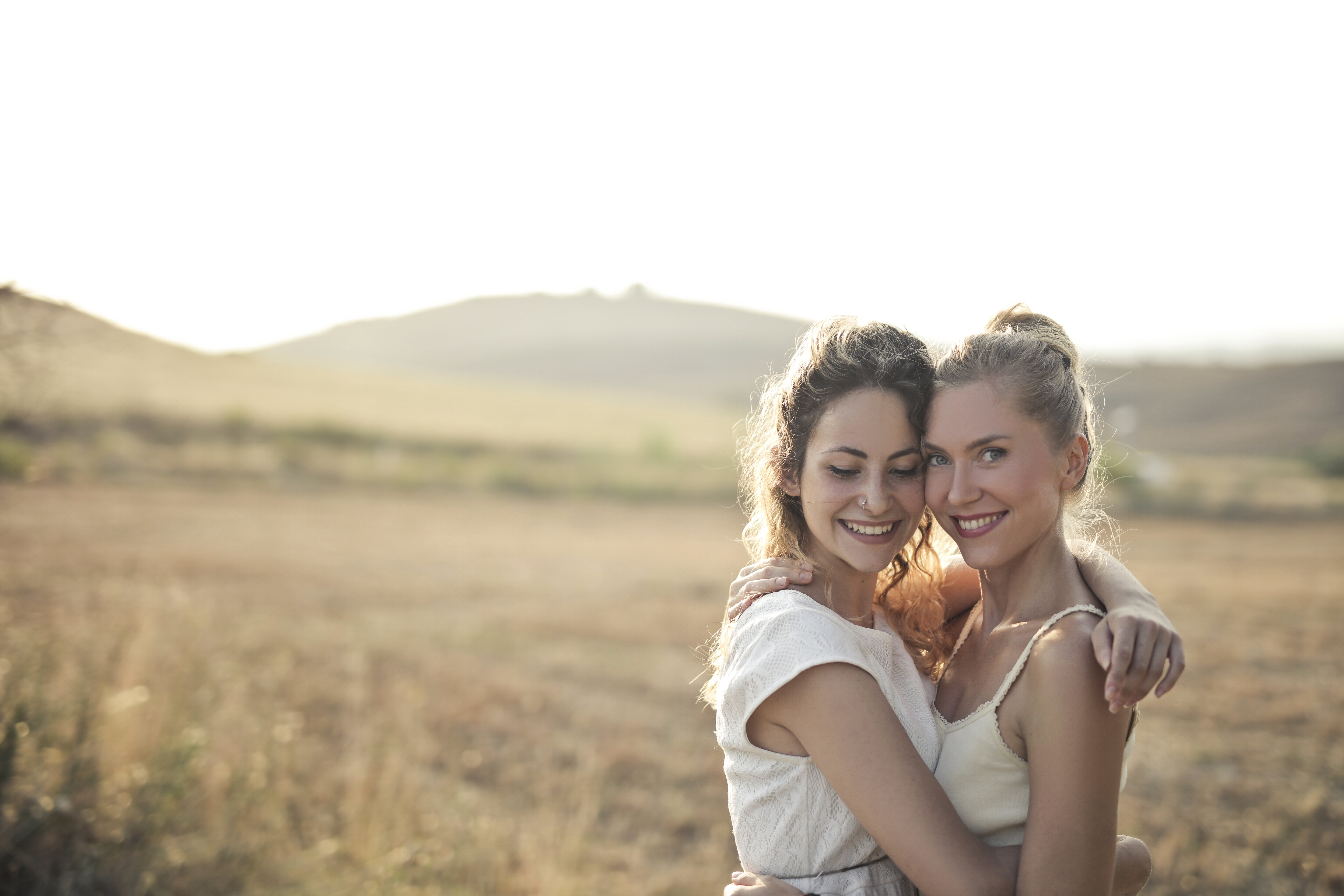 People 7680x5120 women two women outdoors smiling hugging white clothing field model brunette blonde nose ring women outdoors