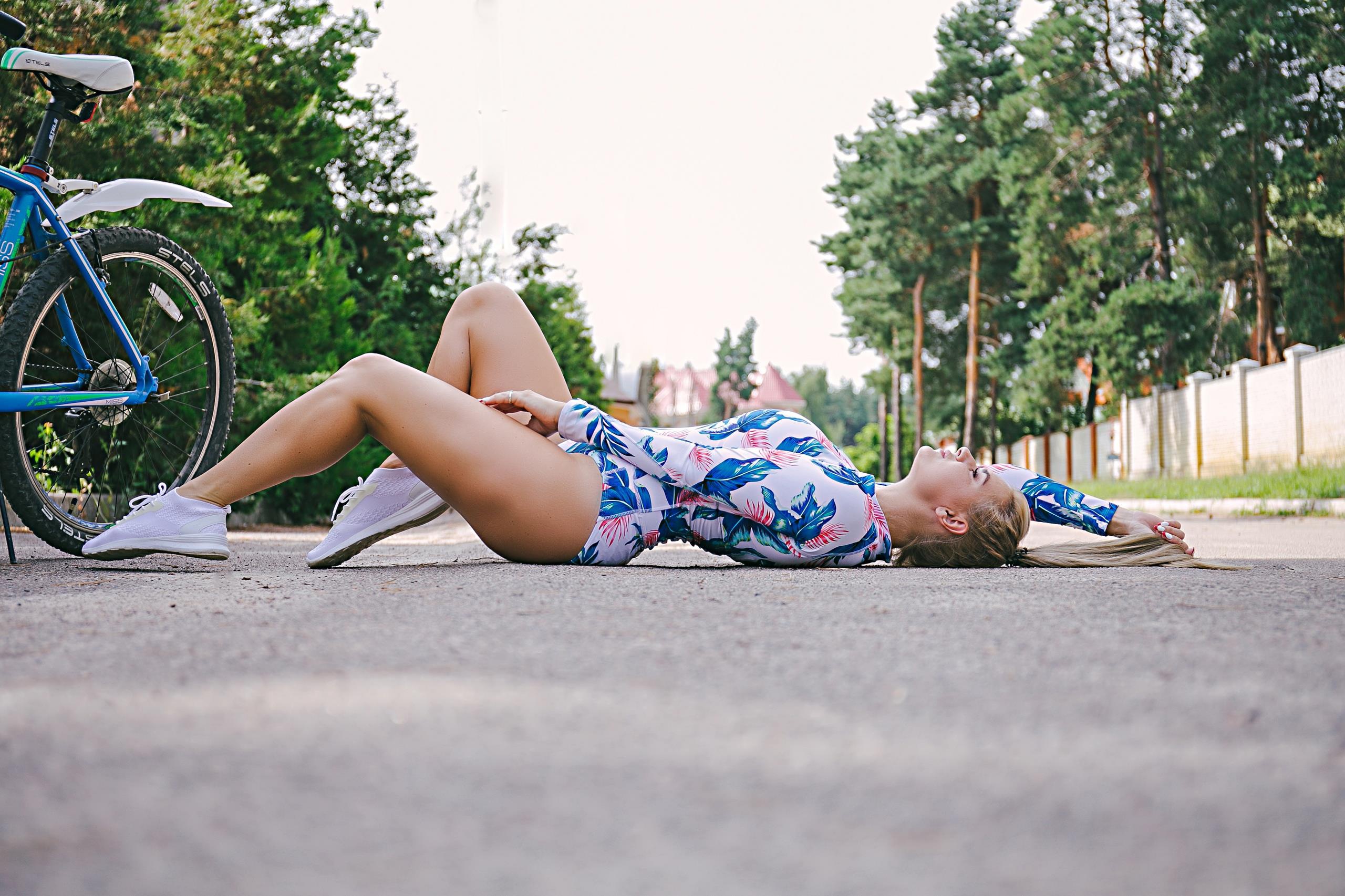 People 2560x1706 women outdoors urban lying down bicycle women blonde ponytail women with bicycles bodysuit lying on back