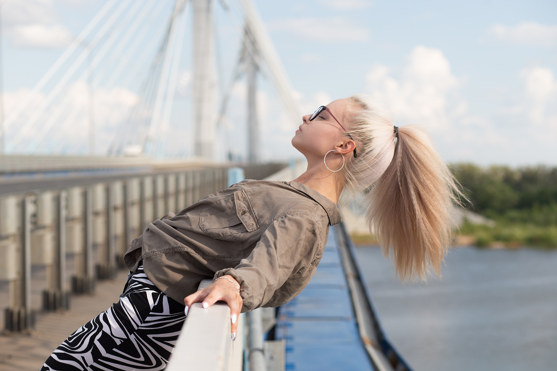 People 1800x1200 women model blonde ponytail shirt pants outdoors depth of field women with glasses glasses hoop earrings closed eyes profile side view painted nails white nails bridge portrait arched back women outdoors Aleksey Lozgachev windy
