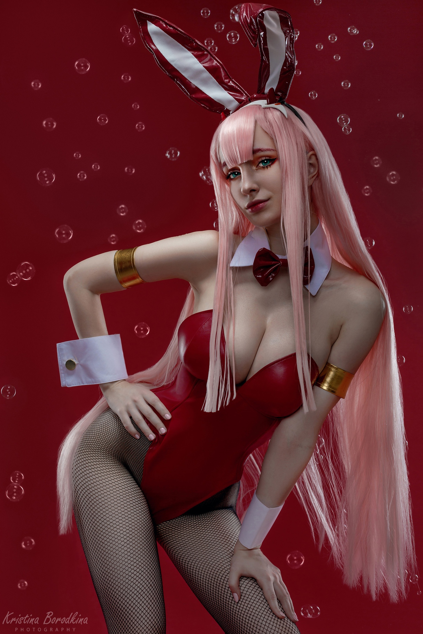 People 1440x2160 women cosplay Darling in the FranXX Zero Two (Darling in the FranXX) pink hair long hair straight hair bodysuit bunny girl Alexandra Kuznetsova Kristina Borodkina makeup blue eyes fishnet cleavage bow tie bunny ears bubbles red background bangs red clothing