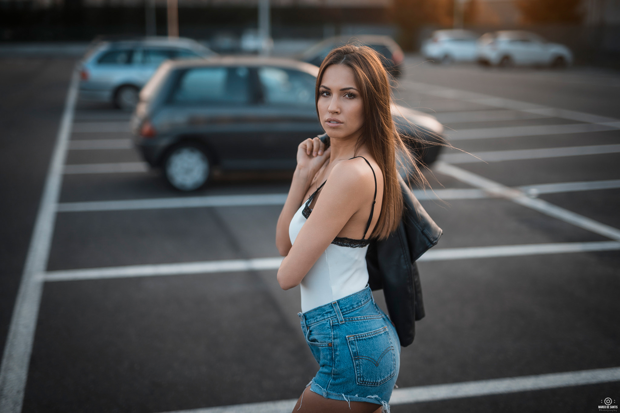 People 2048x1367 women jean shorts women outdoors parking brunette leather jacket Marco De Santis looking at viewer brown eyes looking over shoulder open mouth long hair straight hair women with cars standing pink lipstick Elisa blue shorts holding jacket