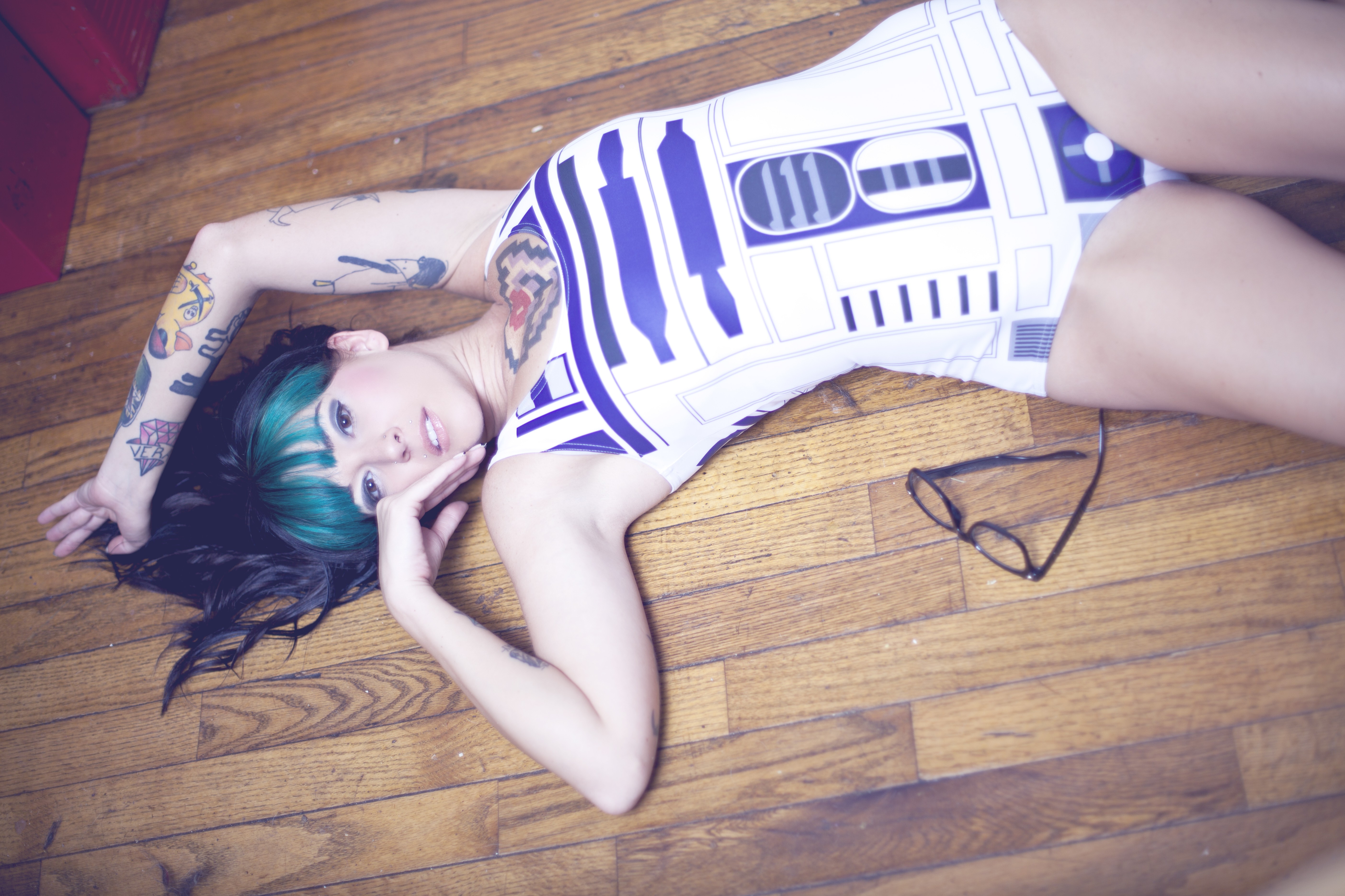 People 5616x3744 women green hair R2-D2 tattoo bodysuit Star Wars Droids glasses dyed hair on the floor women indoors makeup looking at viewer indoors