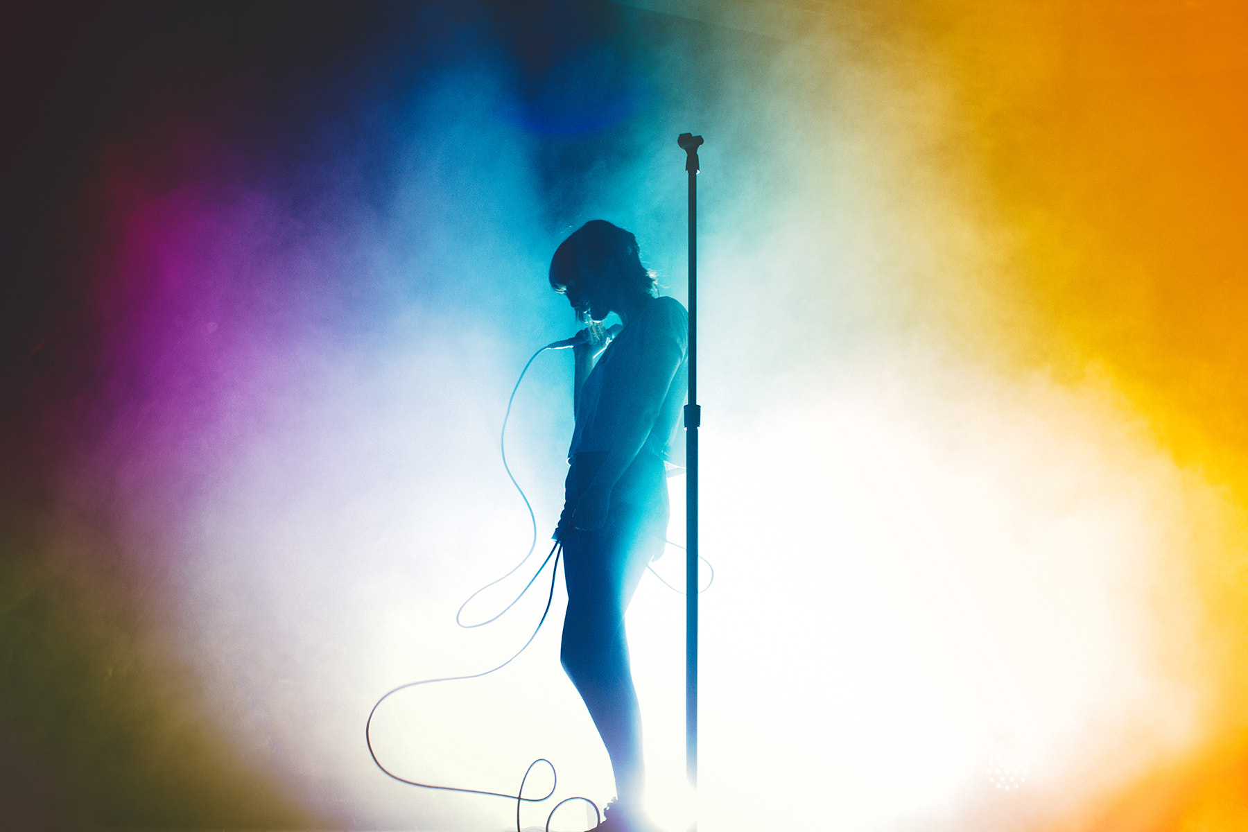 People 1800x1200 concerts silhouette Lauren Mayberry Chvrches stages stage shots stage light singer musician yellow cyan haze