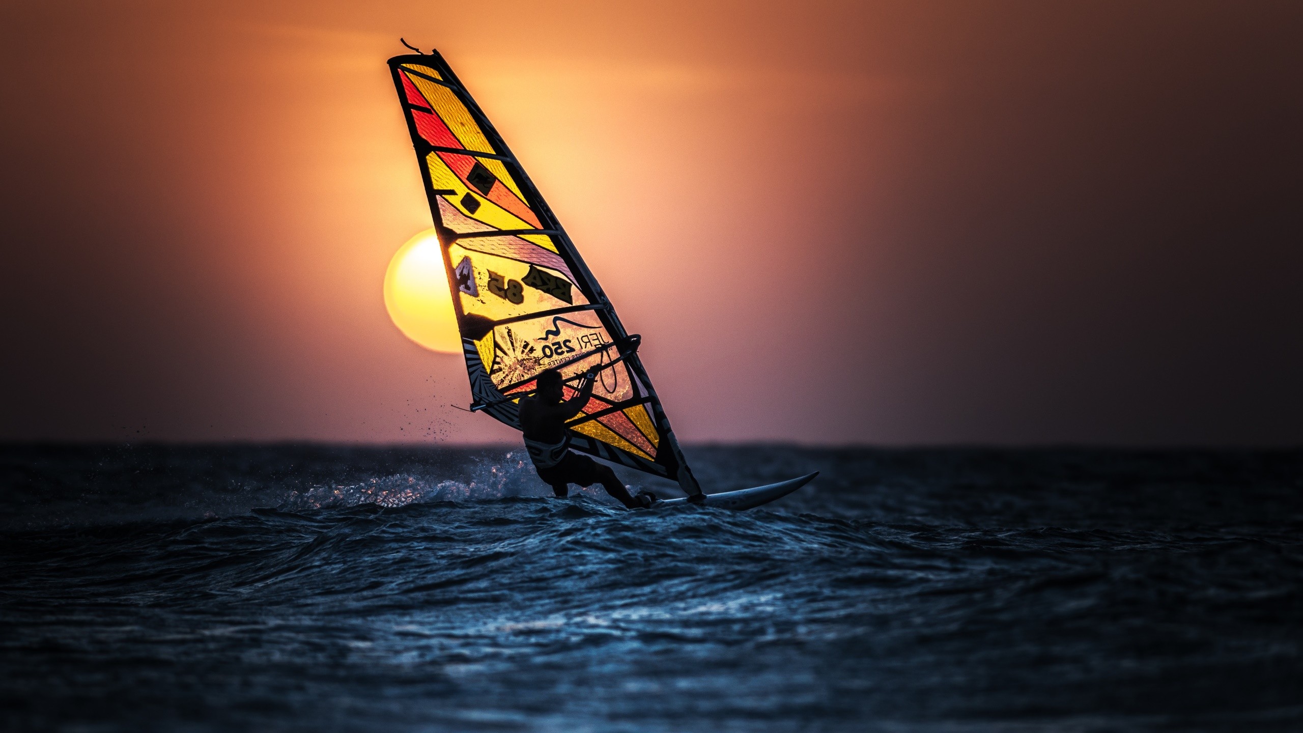 People 2560x1440 windsurfing sport sea Sun