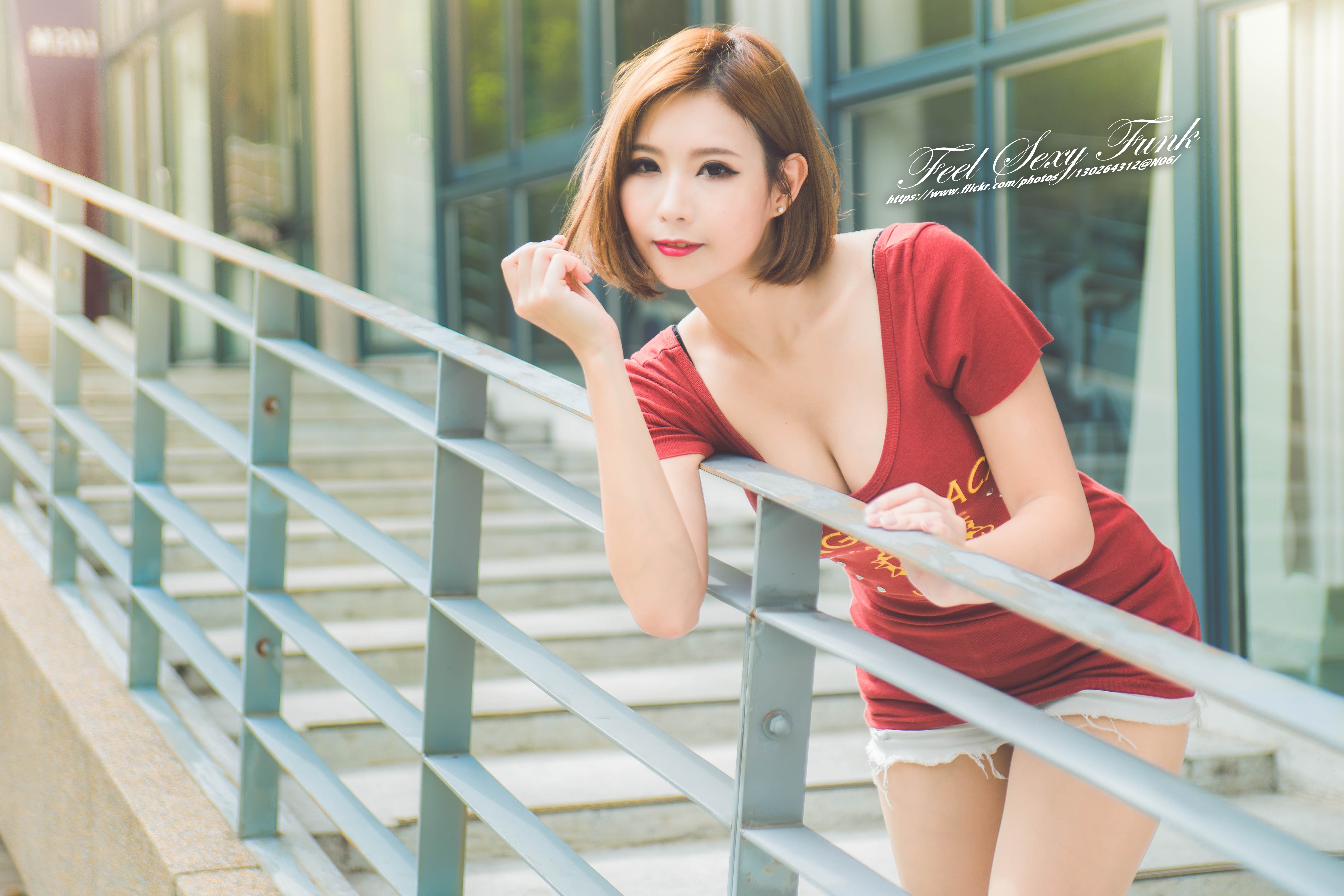 People 5605x3737 cleavage red dress redhead short hair looking at viewer women Asian model women outdoors dyed hair dark eyes lipstick red lipstick red shirt printed shirts red clothing pulling hair