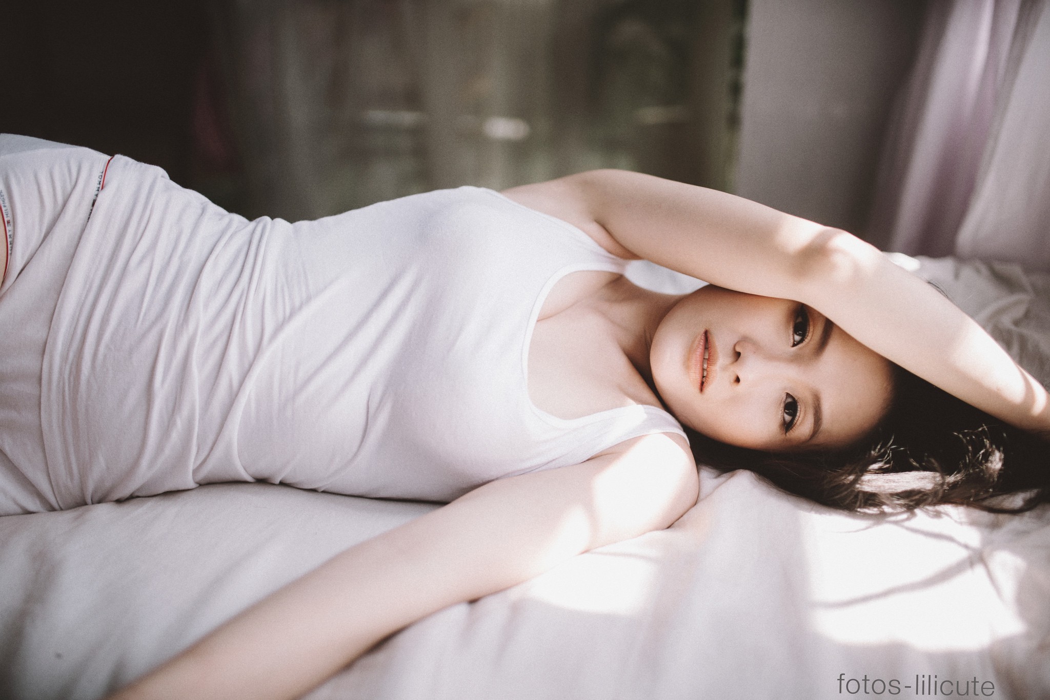 People 2048x1367 women Asian brunette lying on side in bed arms up tank top