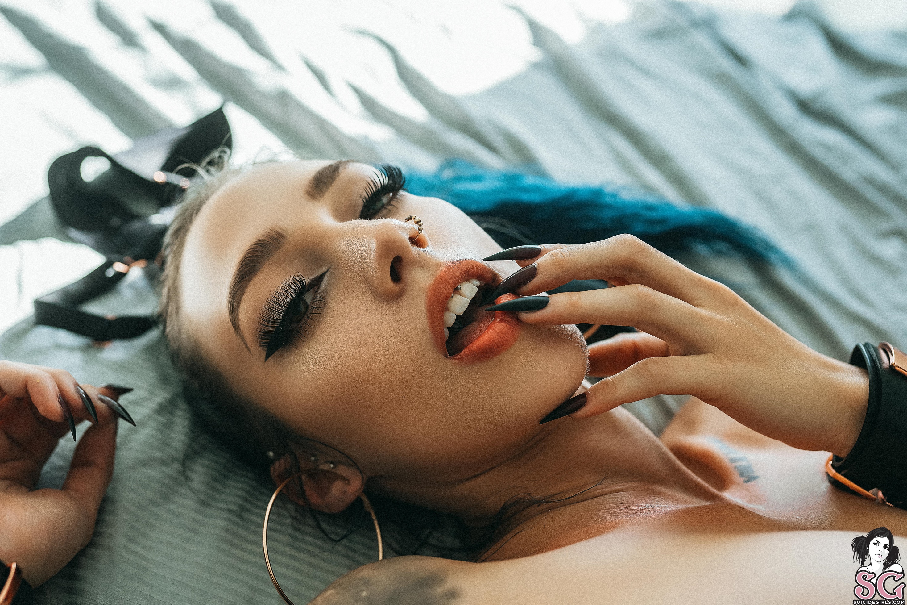 People 2940x1960 Suicide Girls women model Luna Lavendre face pierced nose lying on back eyelashes in bed open mouth fake nails watermarked closeup