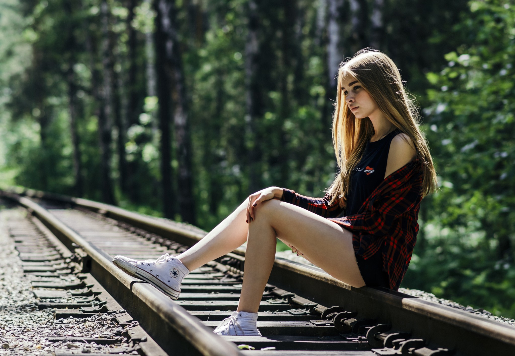 People 2048x1418 women T-shirt women outdoors sneakers model blonde plaid shirt legs sitting railway sunlight printed shirts white shoes outdoors thighs looking away