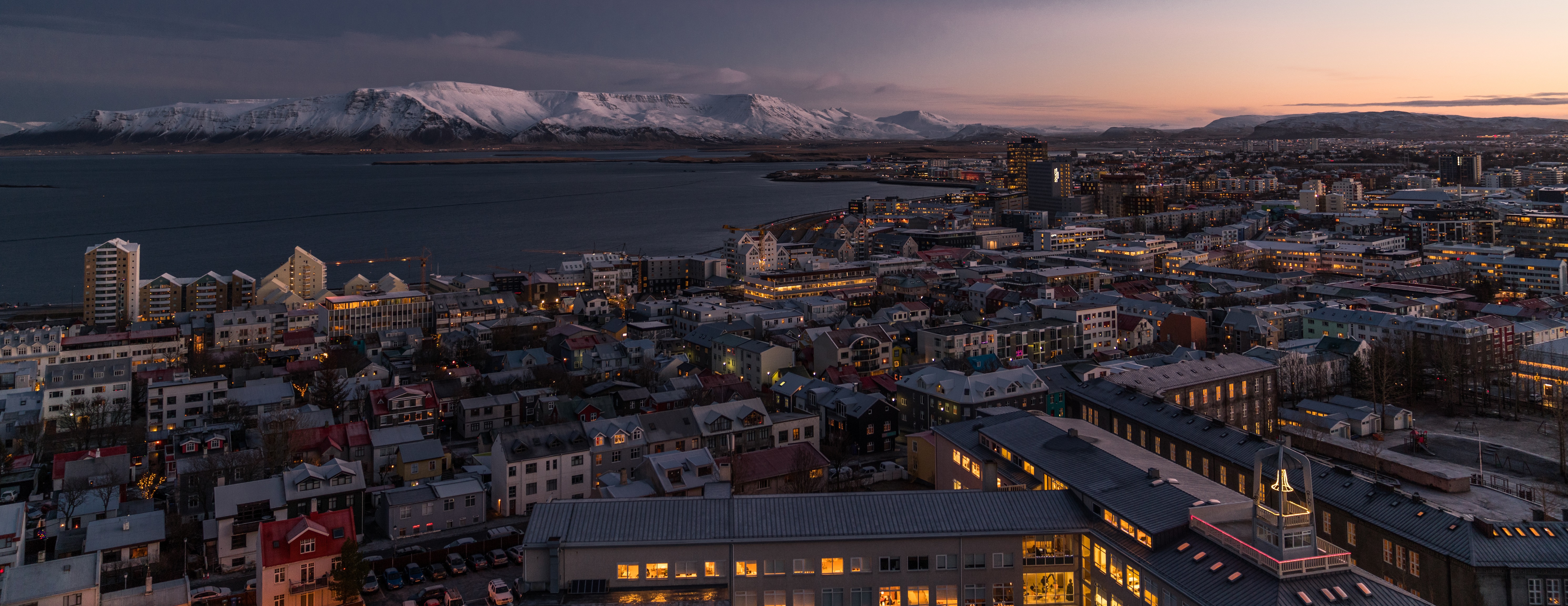 General 5964x2304 city sunset mountains snow multiple display city lights Reykjavik