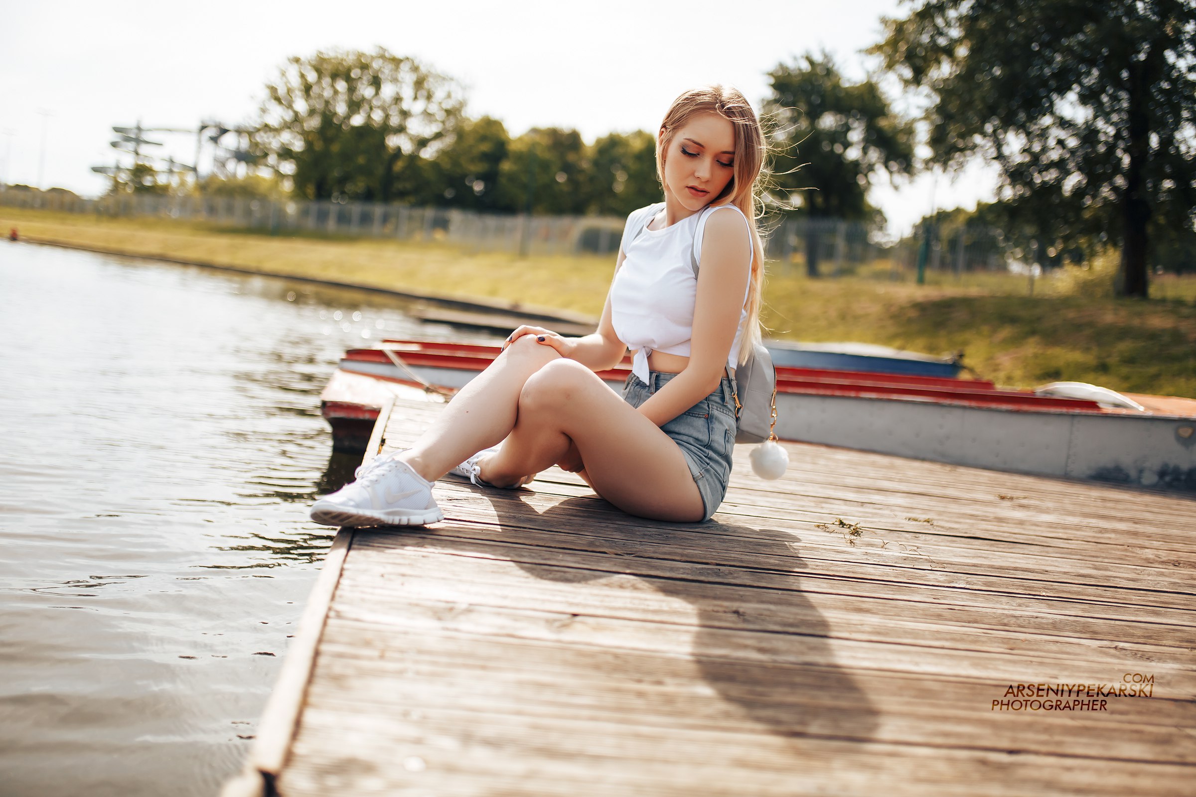 People 2400x1600 women blonde sitting pier sneakers Nike boat handbags women outdoors water portrait painted nails jean shorts