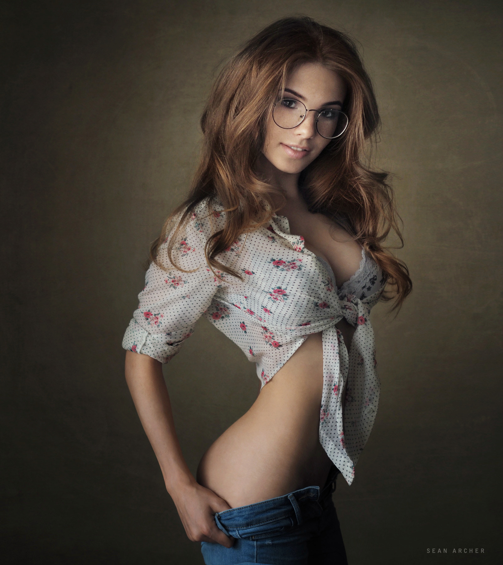 People 1603x1800 Sean Archer women brunette long hair wavy hair makeup glasses looking at viewer smiling freckles tied top bra lace dots pants down jeans undressing denim simple background Anna Fedotova bottomless women with glasses